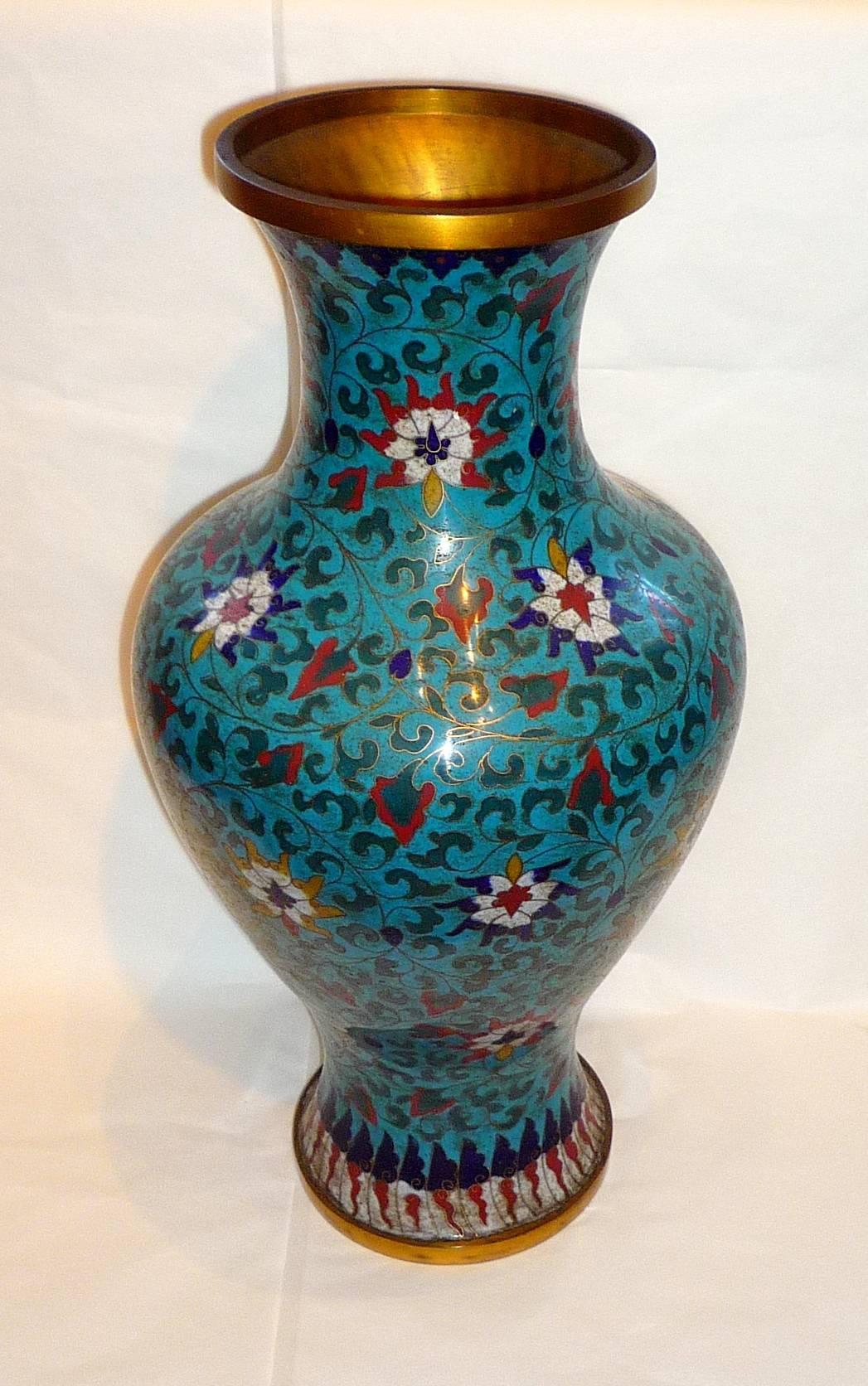 A pair of large 19th century Chinese cloisonné on blue back ground vases, with an apocryphal mark underneath.
They can be mounted as lamps.