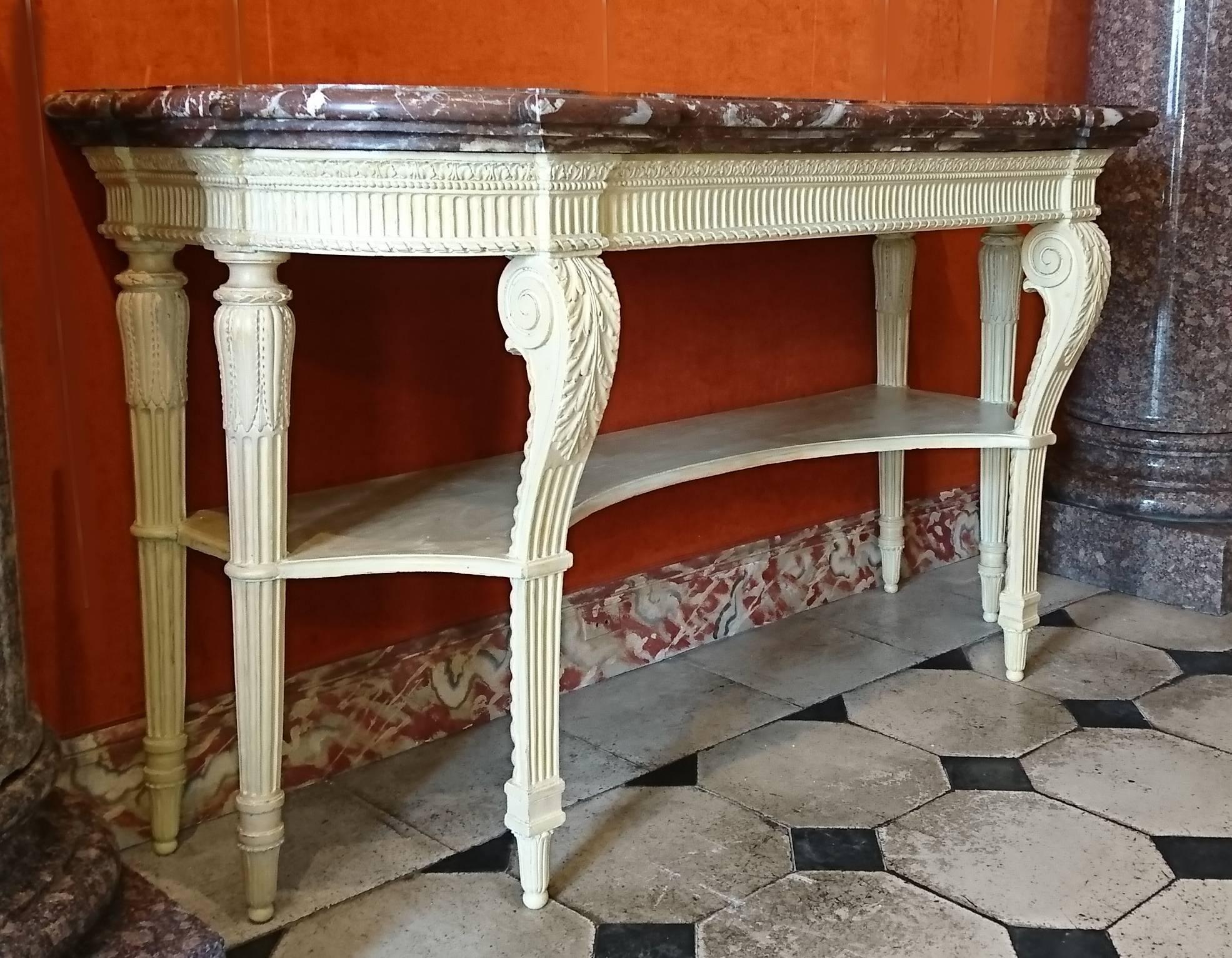 A fine French Louis XVI period carved and painted wood console table with six legs, the two front one with scrolls, attributed to Georges Jacob, the Languedoc red marble top original, circa 1775-1780.