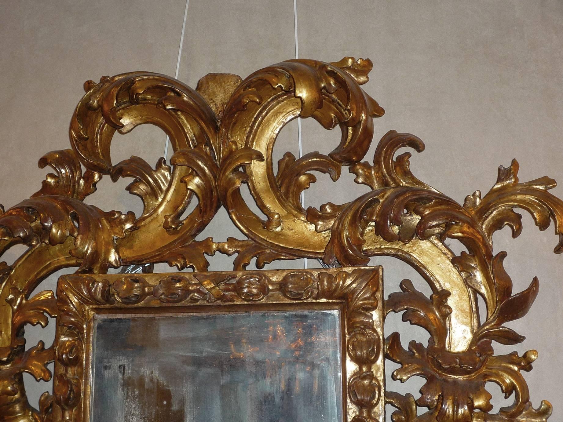 Early 18th Century Rare Roman Baroque Carved and Giltwood Mirror, with a Grotesque Head, 1700 For Sale