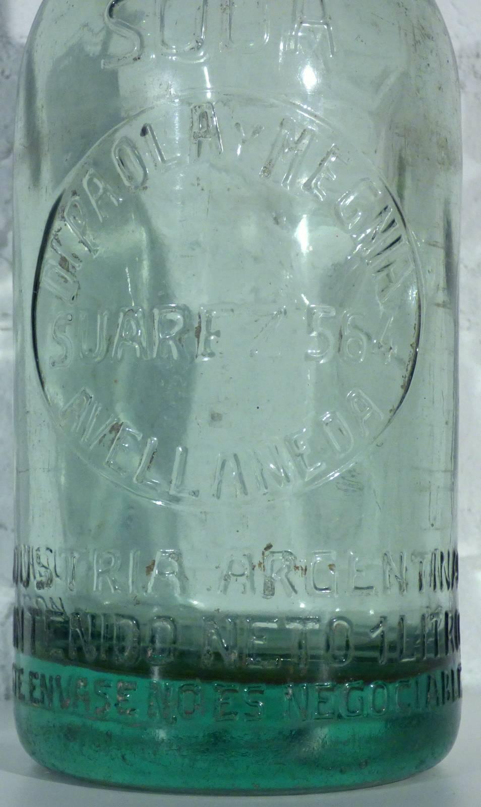 The soda bottle is in great vintage condition. Embossed lettering and thick glass.