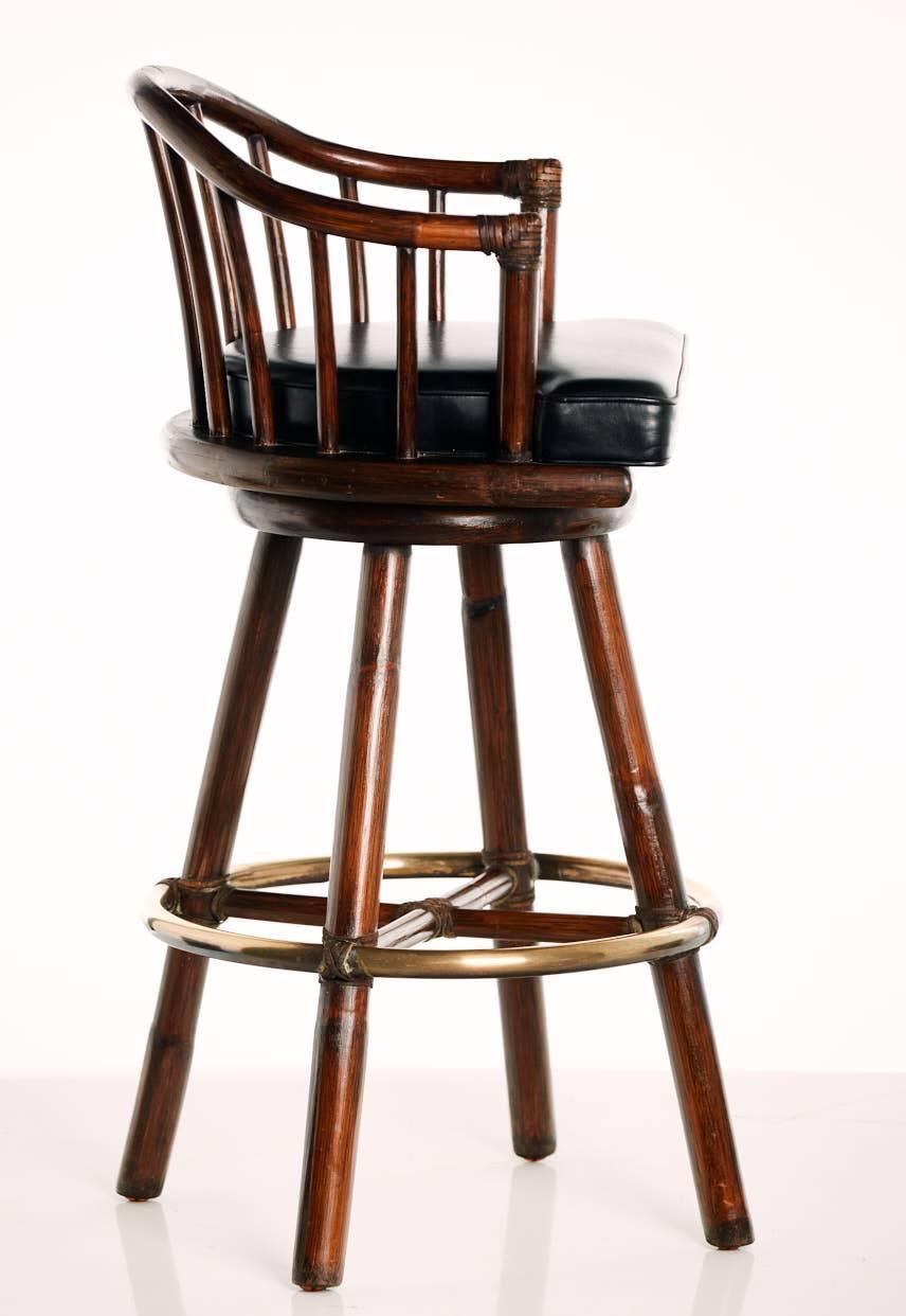 Two Mid-Century swivel bar stools with leather pad, leather bindings and brass footrest.
Just ask for precise shipping price.