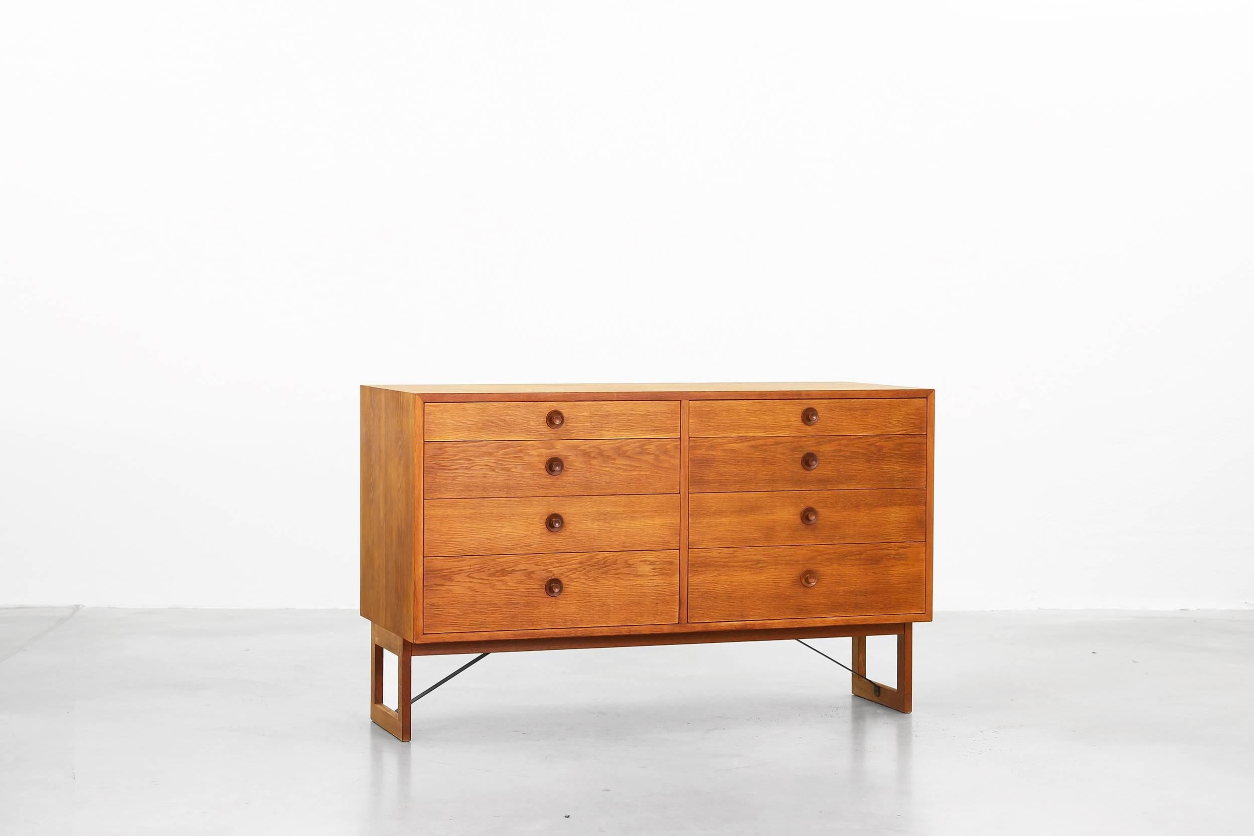 This oak sideboard was designed by Børge Mogensen and produced by Karl Andersson & Söner in Denmark during the 1950s. This piece is still in a very good condition with patinated oak and little traces of usage. Very beautiful and ready for usage.
