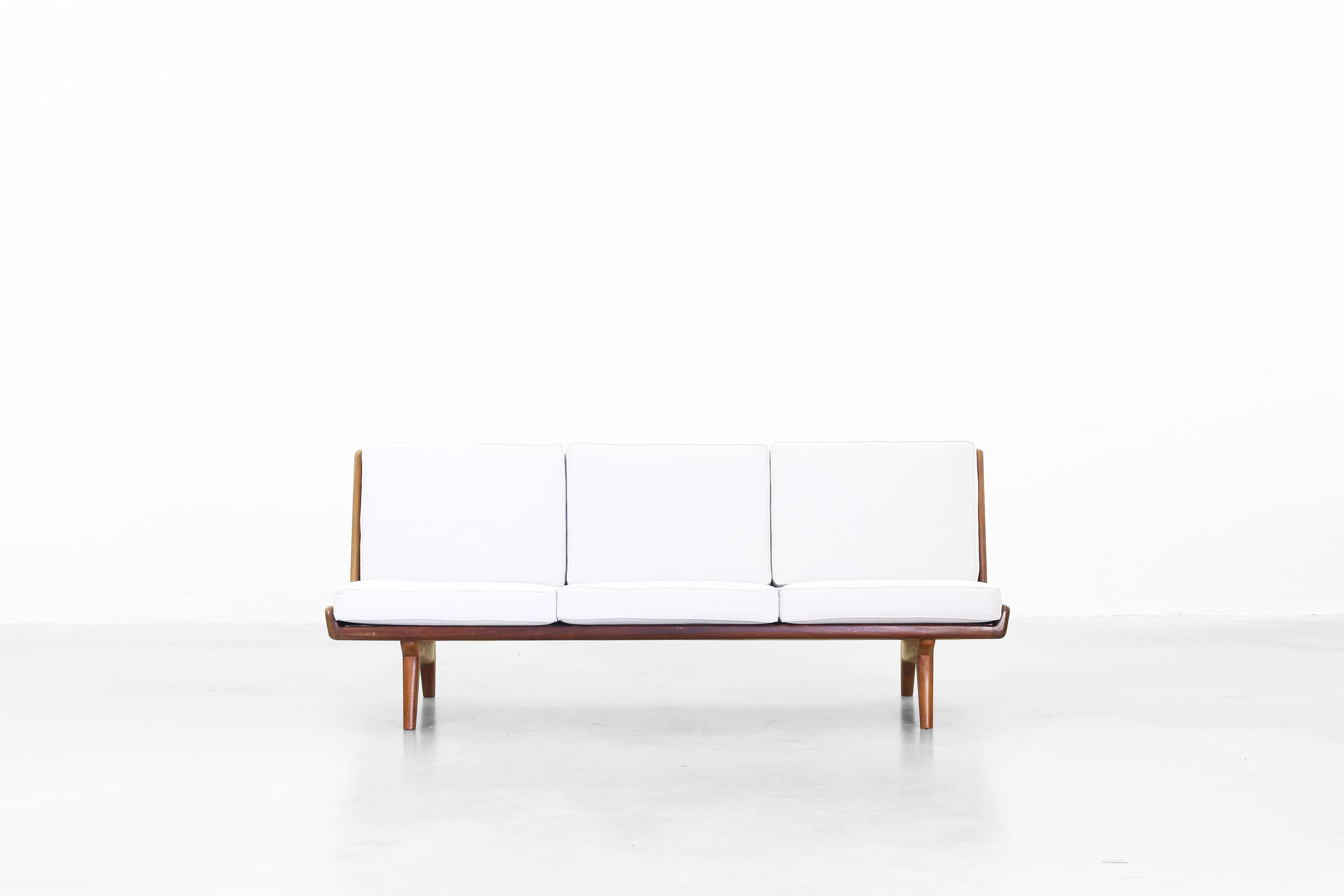 Very beautiful sofa designed by Carl Gustaf Hiort af Ornäs, Sweden in 1950. The sofa is in a very good condition. The cushions were newly reupholstered with a high quality fabric by 
