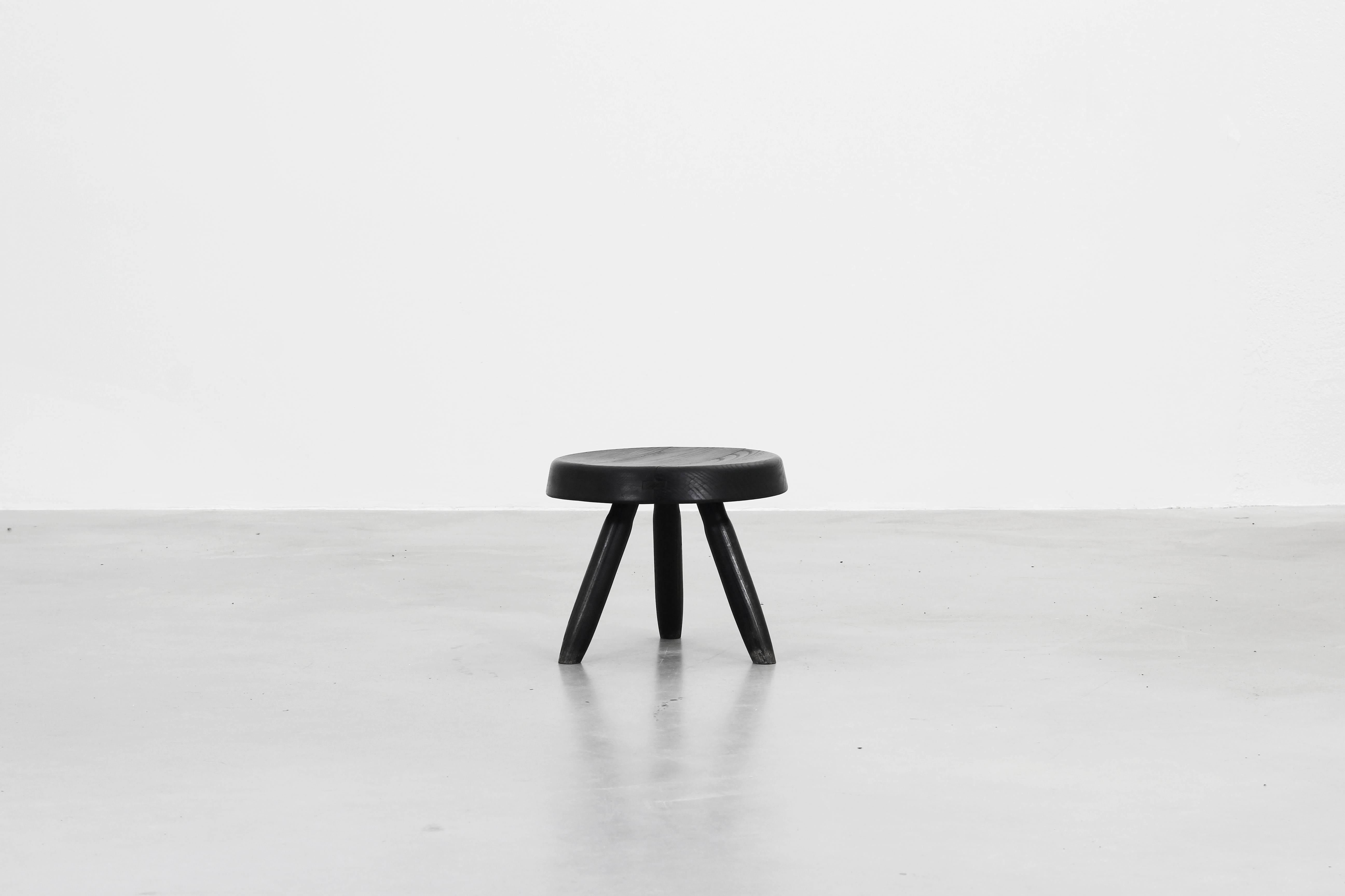 Very beautiful little stool designed by Charlotte Perriand in black lacquered ashwood, beautiful patina on the legs and on the seat. Manufactured by Steph Simon.