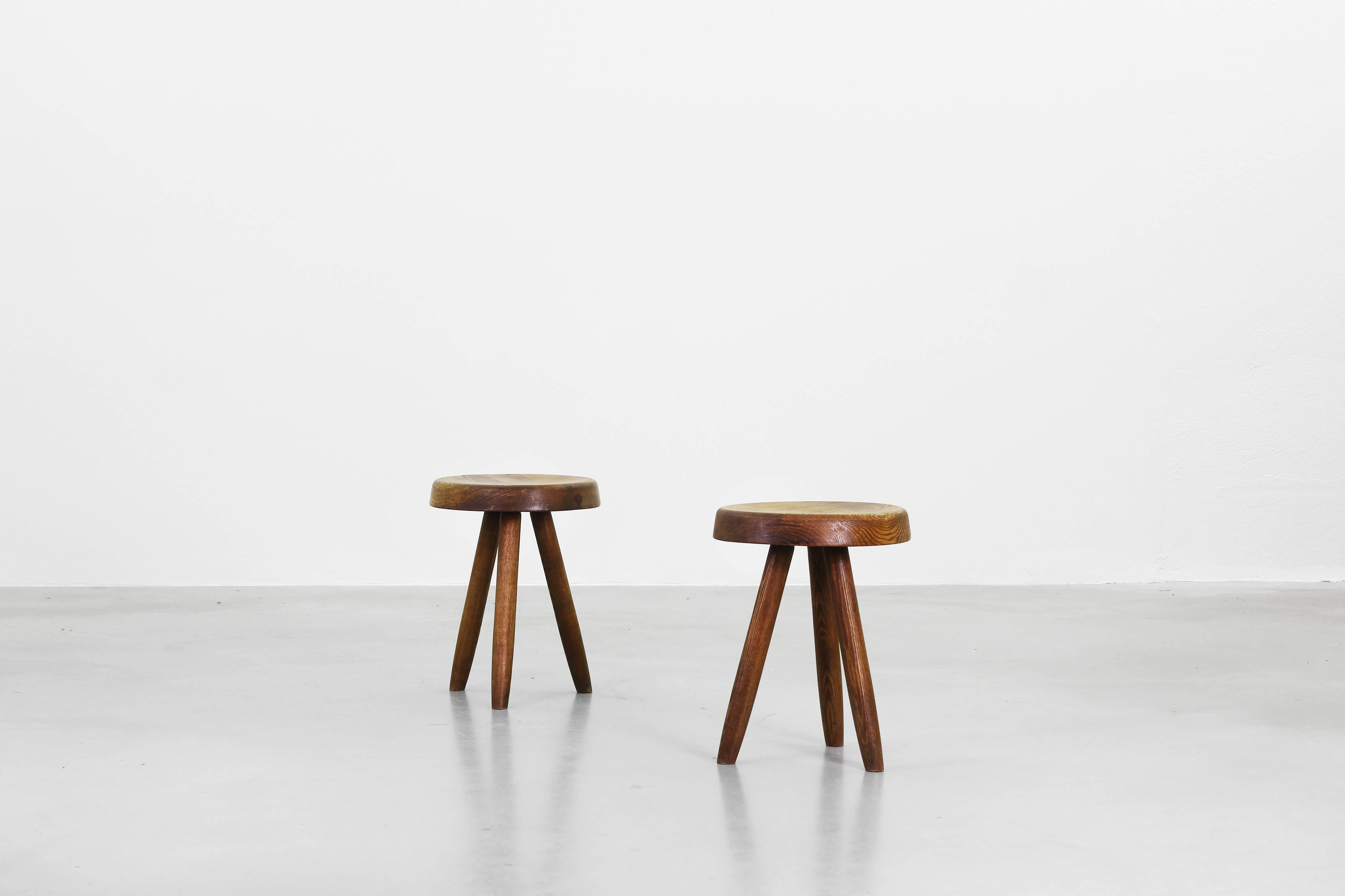 A pair of beautiful stools designed by Charlotte Perriand in ashwood, with gorgeous patina. 
Manufactured by Steph Simon.

The price is for the pair (high stools). 
Please do not hesitate to contact us for a shipping quote.
 