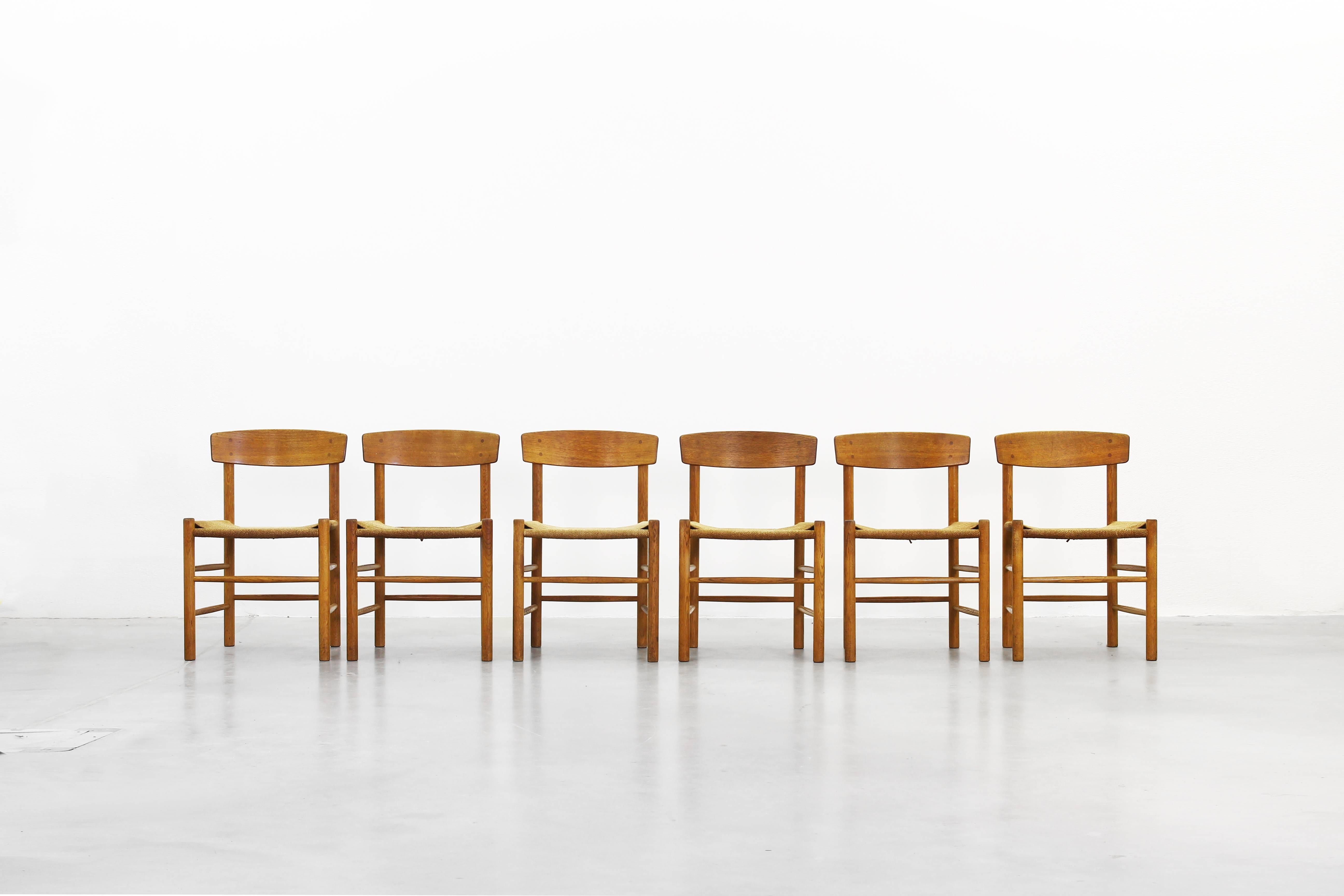 A beautiful set of dining chairs by Børge Mogensen for Fredericia made in the late 1960s in Denmark. These chairs are in a good used condition with signs of use, little abrasions, stains but no breaks or cracks. The frame made of oakwood is