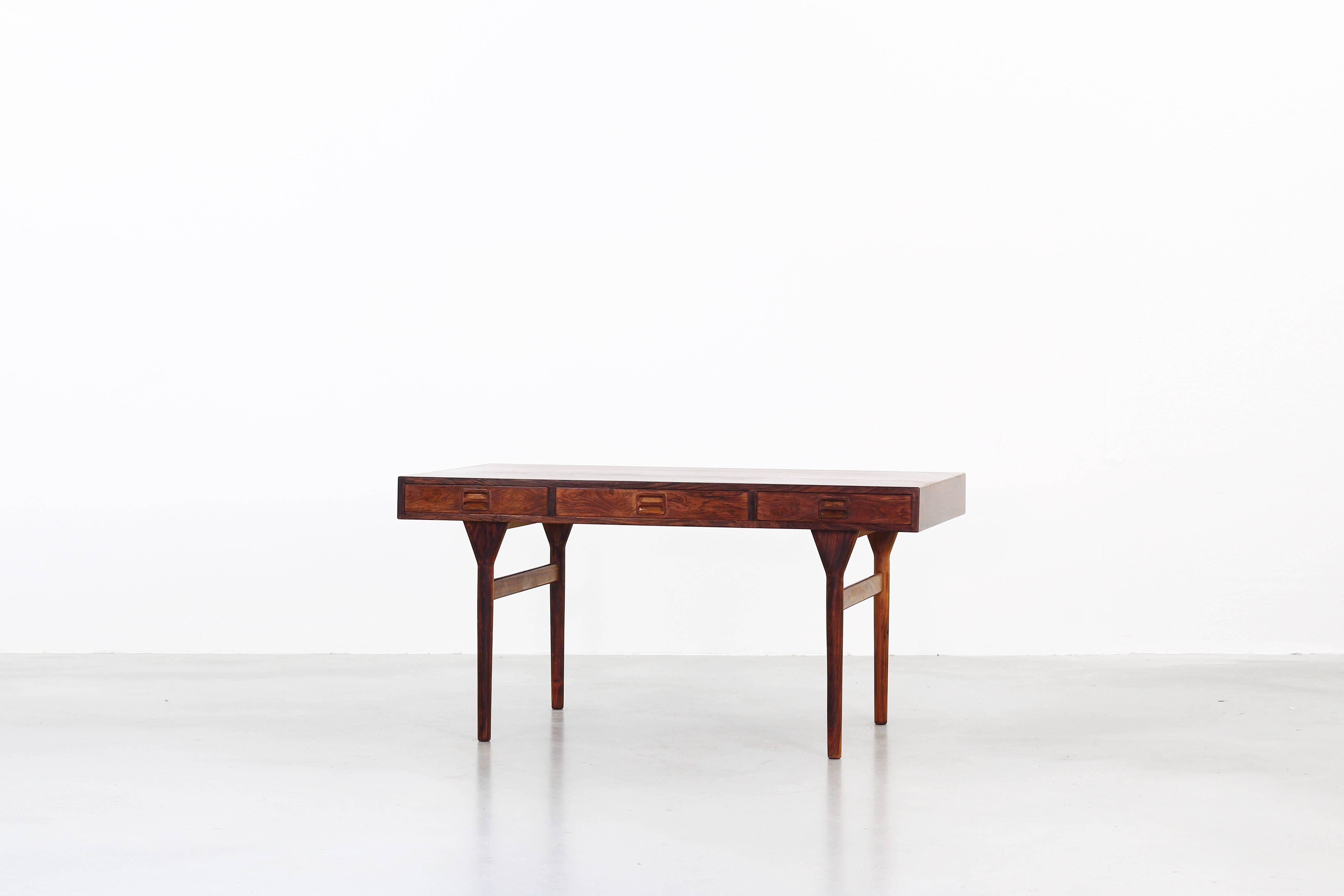 Very beautiful desk designed by Nanna Ditzel for Søren Willadsen Møbelfabrik, made in Denmark in 1955. The desk is made of rosewood and comes with three drawers.