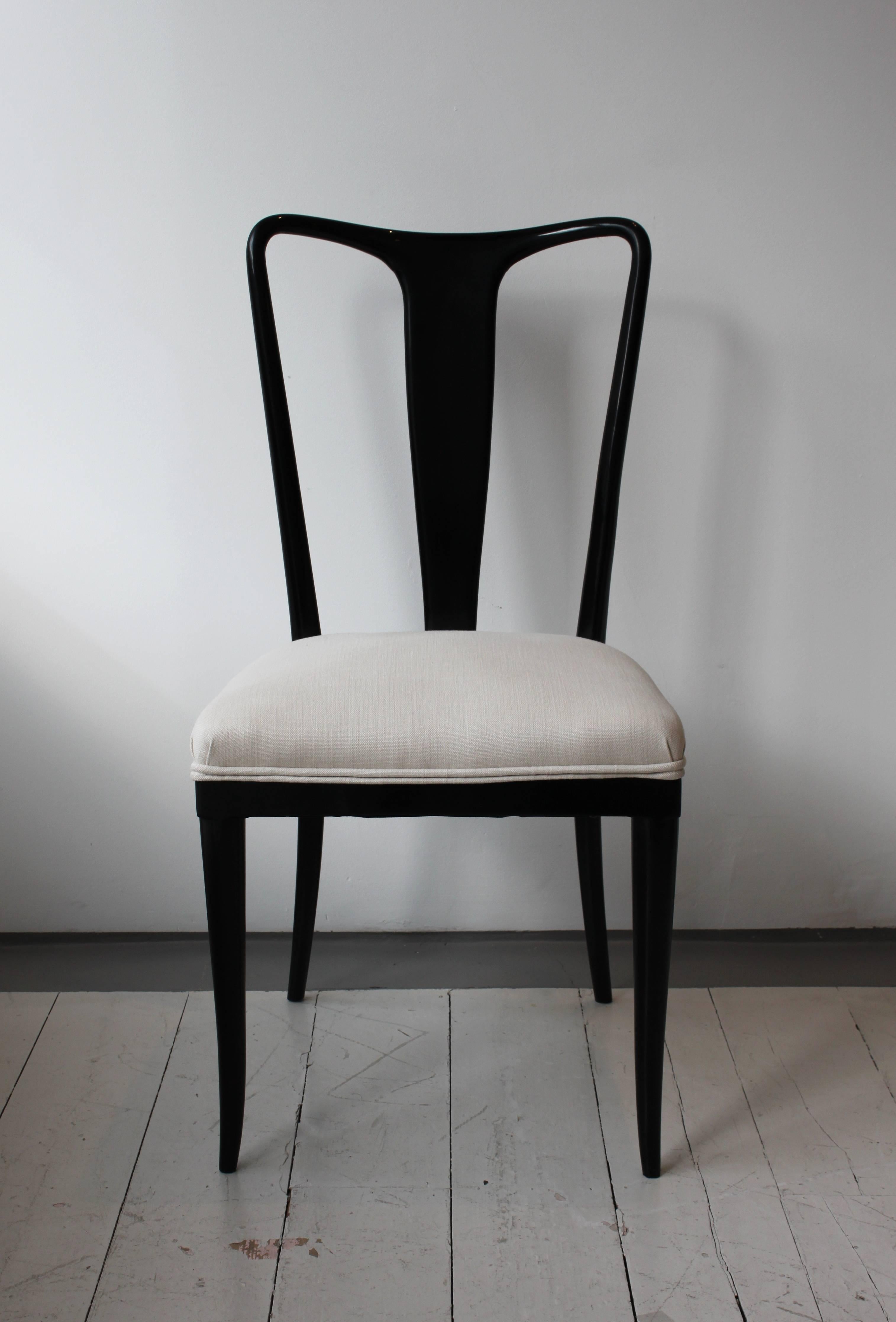 Set of six black lacquered dining chairs by Ulrich.

Seats reupholstered in neutral fabric.

Italian, late 1940s