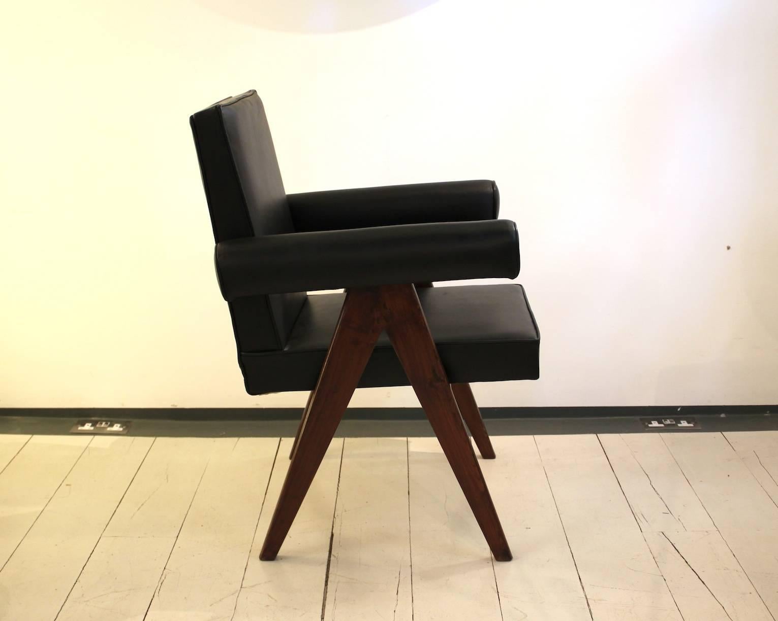Pair of Committee armchairs designed by Pierre Jeanneret for an administrative building in Chandigarh, India.

Model no. PJ-SI-30-A.

Teak and leather.