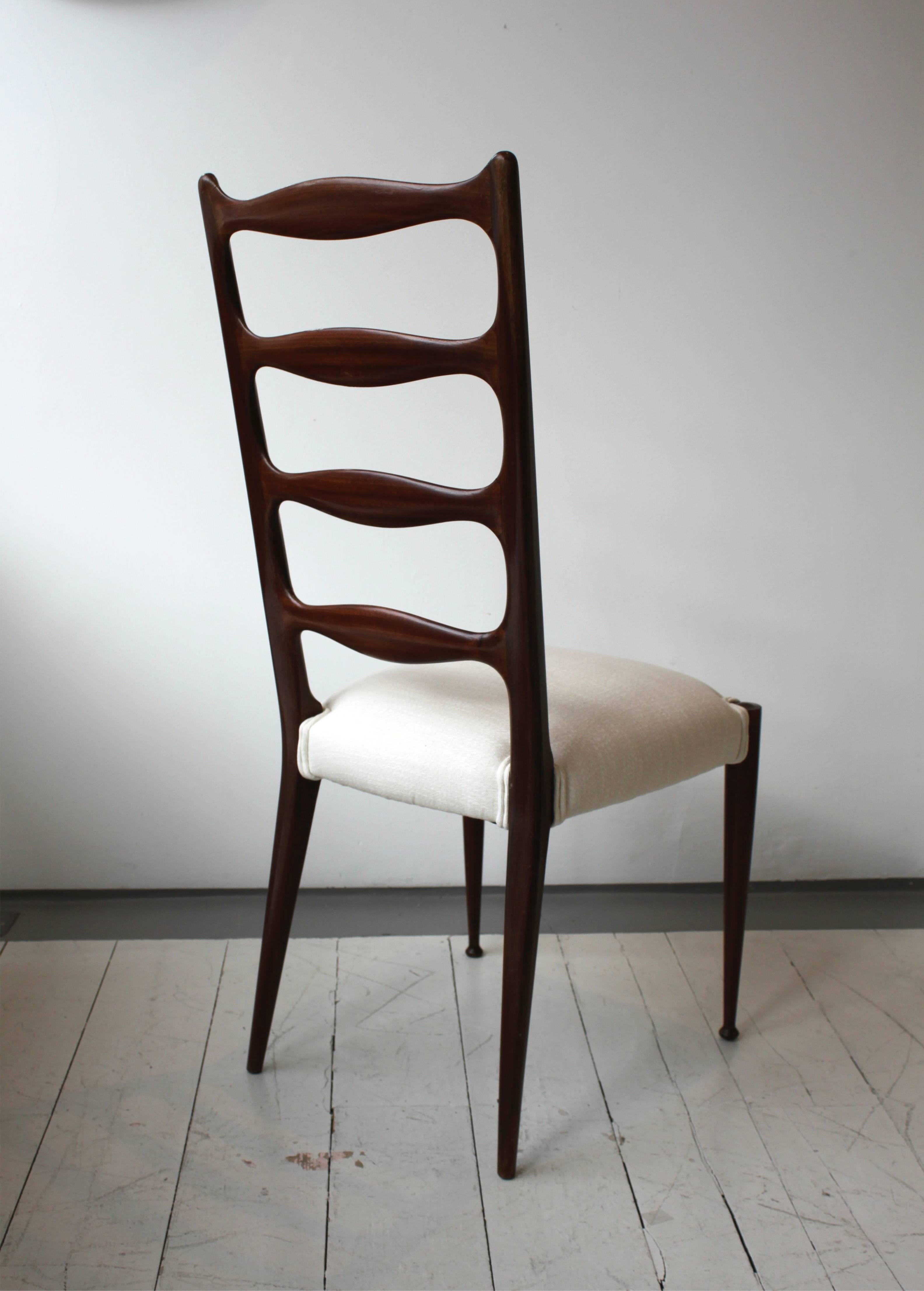 Set of six high back dining chairs by Paolo Buffa.

1950s Italian design.

The seats have been reupholstered in neutral fabric.