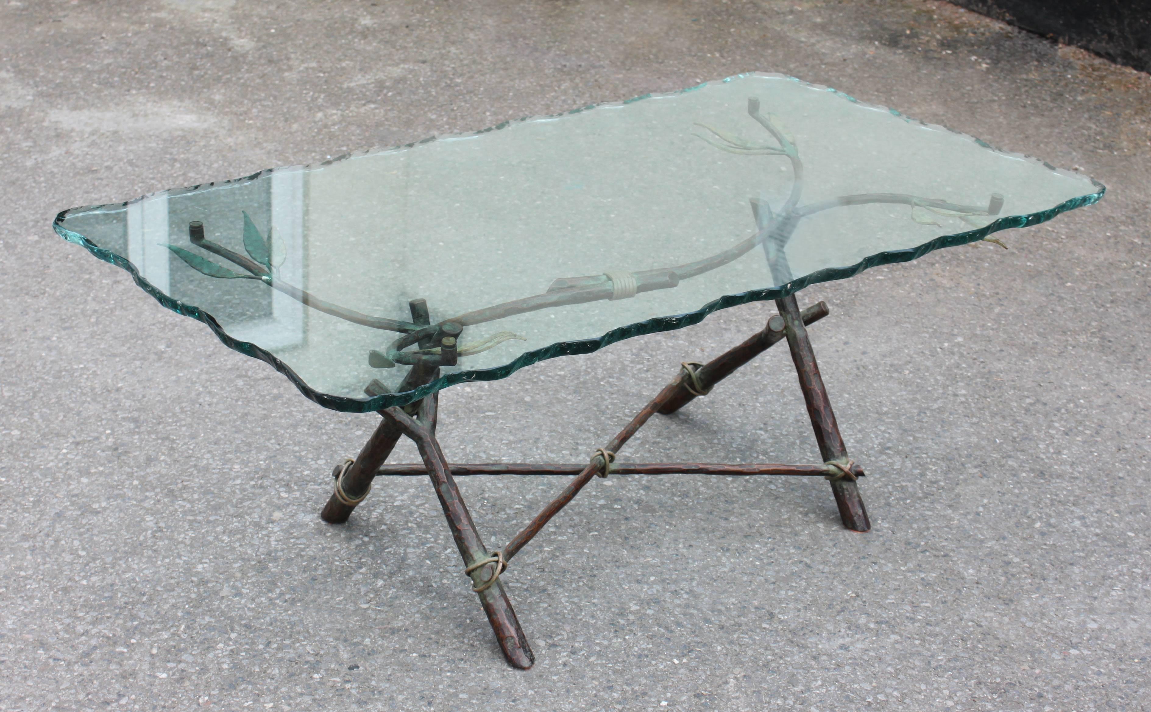 Low table with decorative bronze base and shaped glass top. 
Italian, 1940s.

 