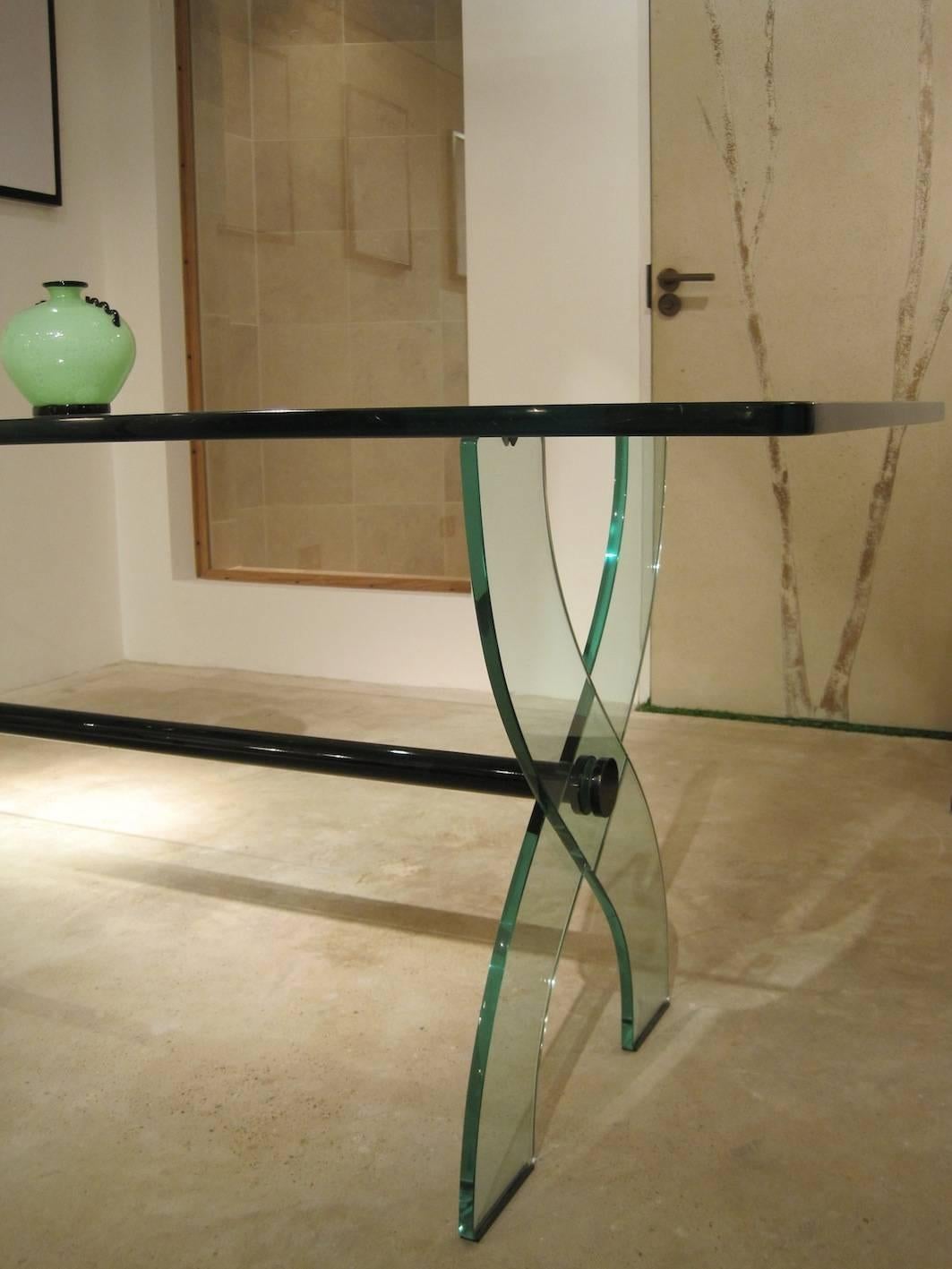Fontana Arte substantial glass and brass table with cornucoppia design base.

Classic Fontana glass,

Italian, 1950s.