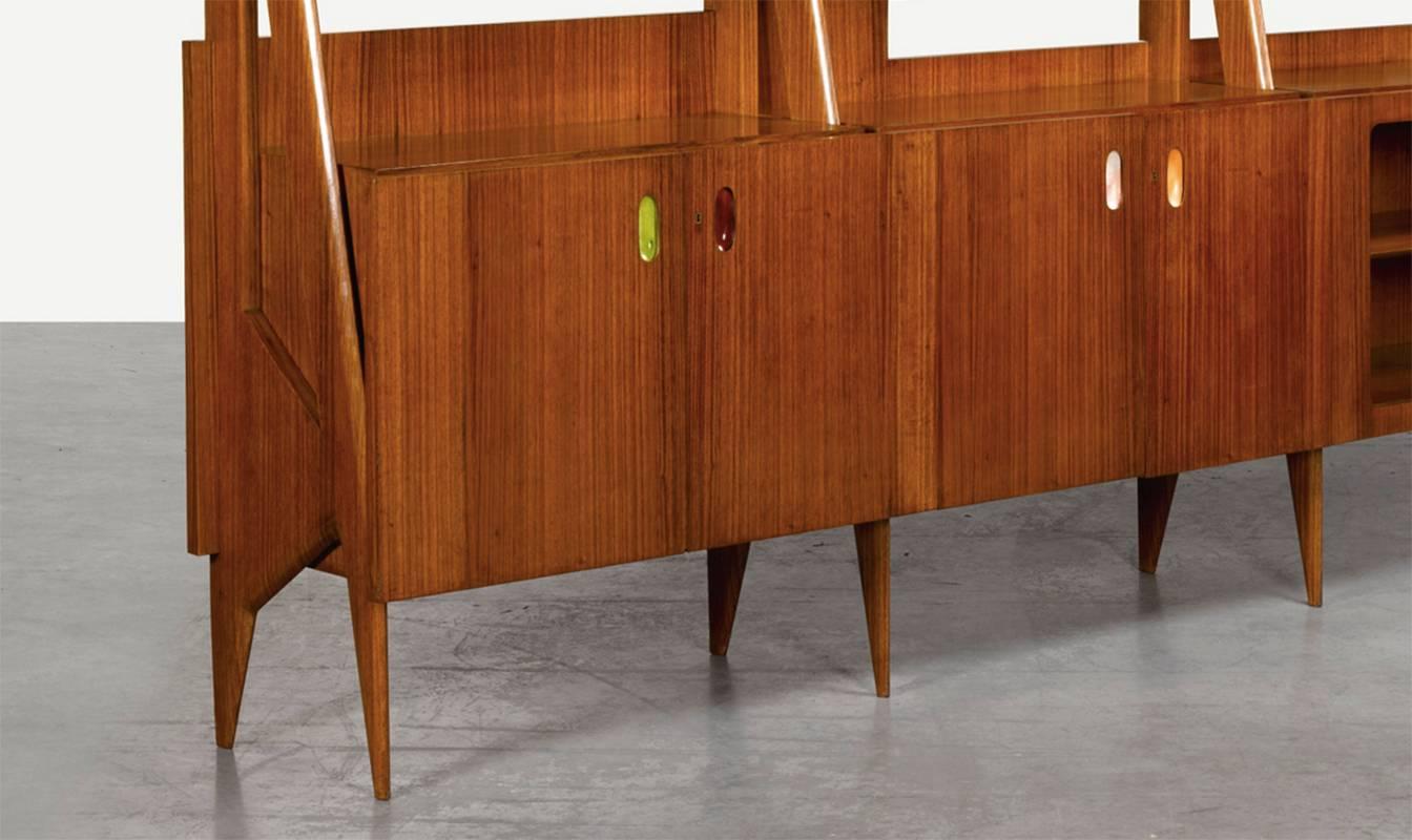 Ico Parisi monumental rosewood bookcase with handles by Flavio Poli.

Each handle with foil label P. DE POLI / MADE IN ITALY

Rosewood, glass, enamelled copper

Italian, circa 1955

With a 