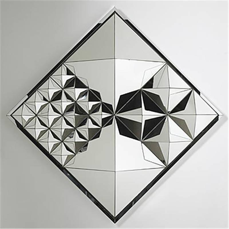 Verner Panton
Diamond pyramid mirror, circa 1974
Mirrored glass, painted wood.
Measures: 32 3/4 x 32 3/4 x 8 1/2 in. (83.2 x 83.2 x 21.6 cm)
Manufactured by Beylerian, USA
Beautiful piece in excellent condition

The sculptured wall mirror is