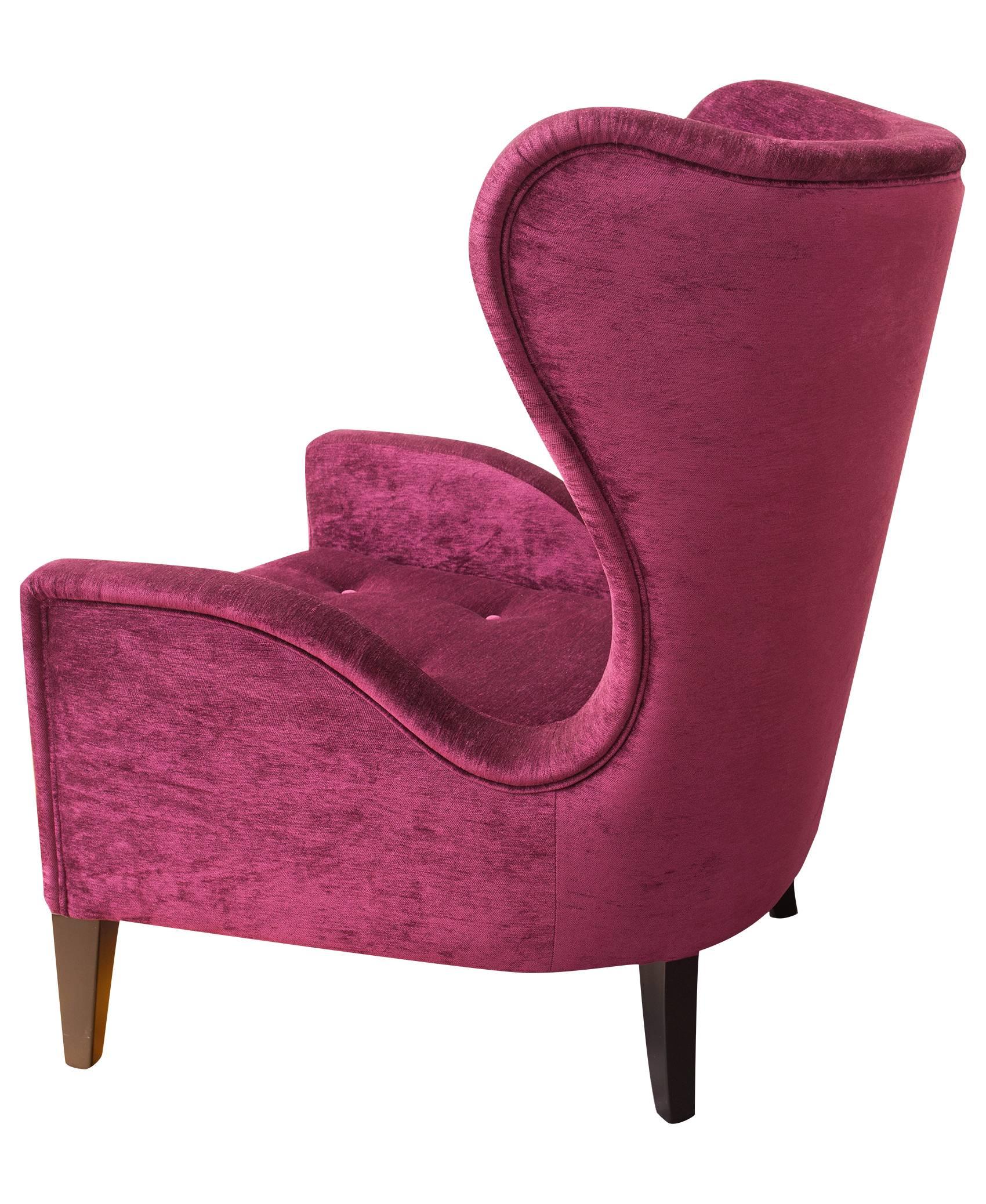 A decidedly contemporary wingback chair with a touch of retro. Commercial grade magenta velvet upholstery with solid wood structure and fire-resistant foams. Incredibly comfortable.