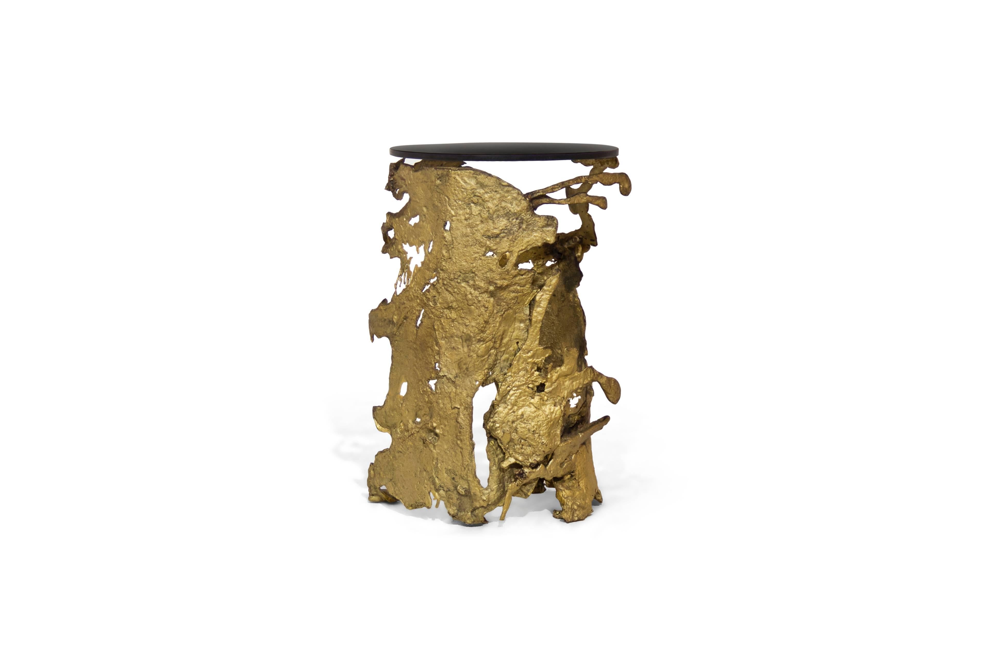 Nature in its rawest form flows through this charismatic furniture piece as lava flows during a volcano eruption. Molded by casted brass and bronze glass, Cay embodies nature’s ultimate scream. Allow yourself to hear the ultimate call, feeling its