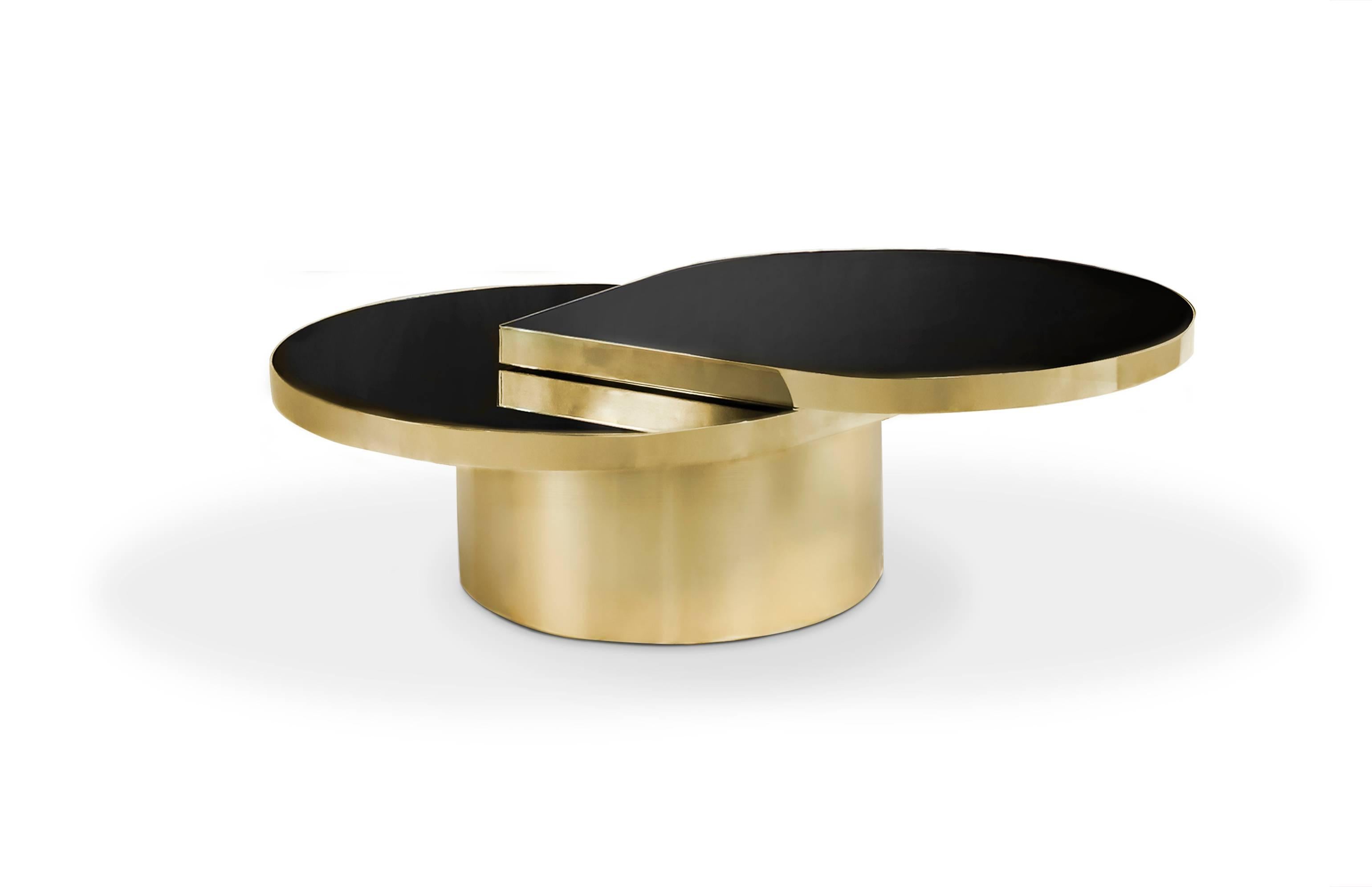 This unique elegant cocktail table is inspired by the delicate, crystal-clear clarity of a teardrop. It's striking combination of black and gold tear-shaped top swivels out to become a two-tiered cocktail table.

Standard Top: Black glass.
(Also