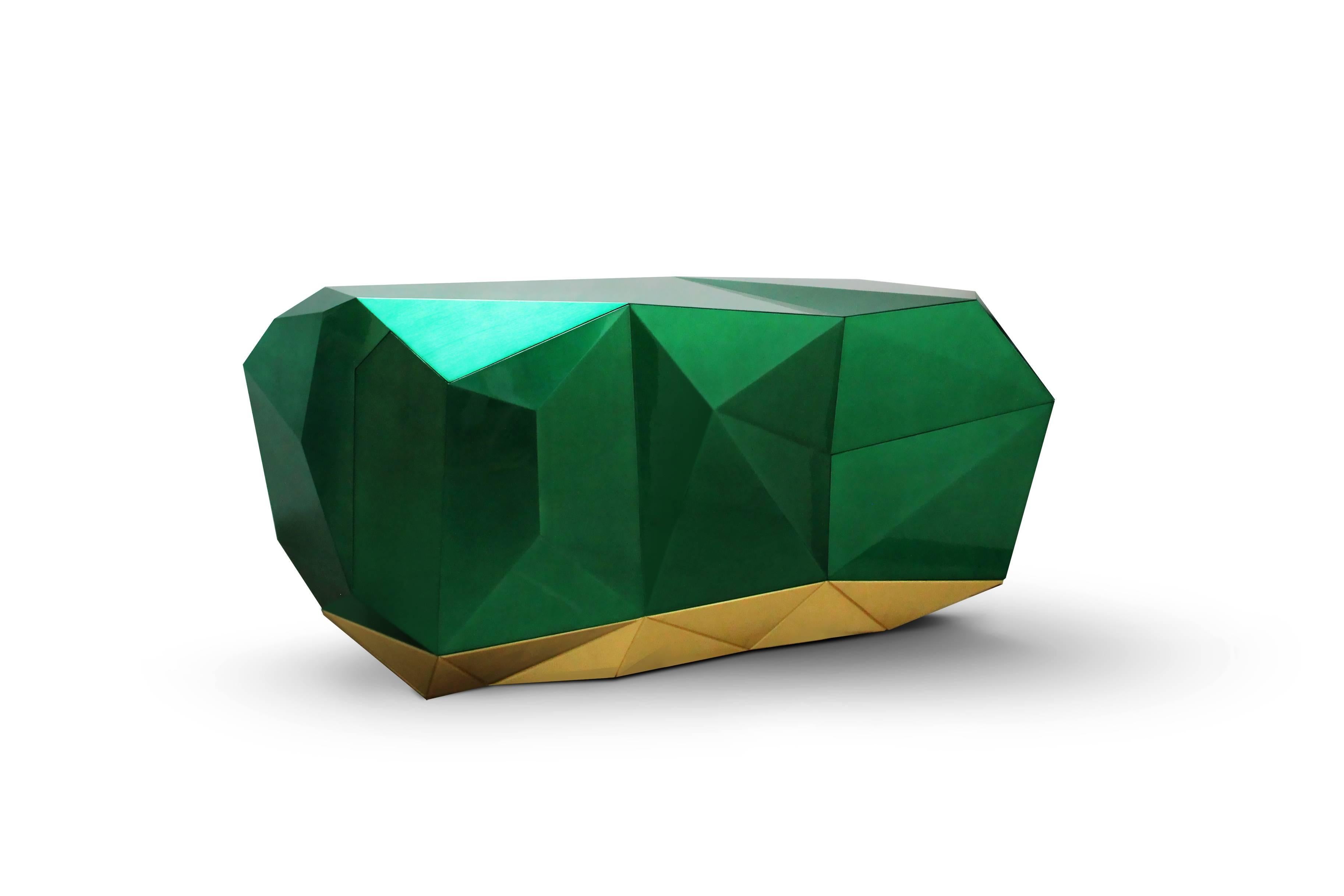 With the style of a precious jewel, the new diamond sideboard is made from wood finished with a luxurious shade of translucent green emerald with high gloss varnish. The faceted sideboard is totally manually produced. It features three highly