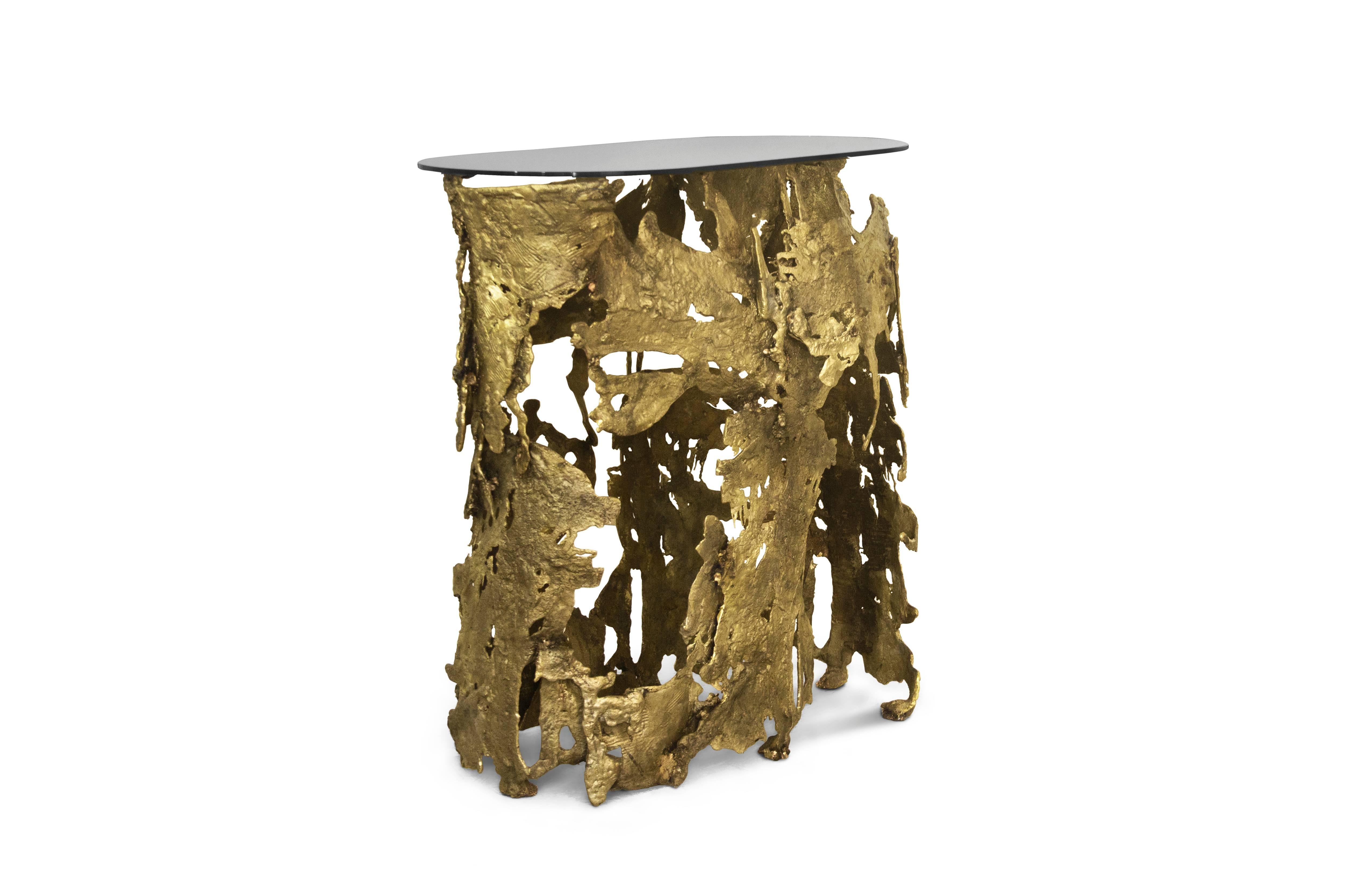 Nature in its rawest form flows through this charismatic furniture piece as lava flows during a volcano eruption. Molded by casted brass and bronze glass, Cay console embodies nature’s ultimate scream. Allow yourself to hear the ultimate call,