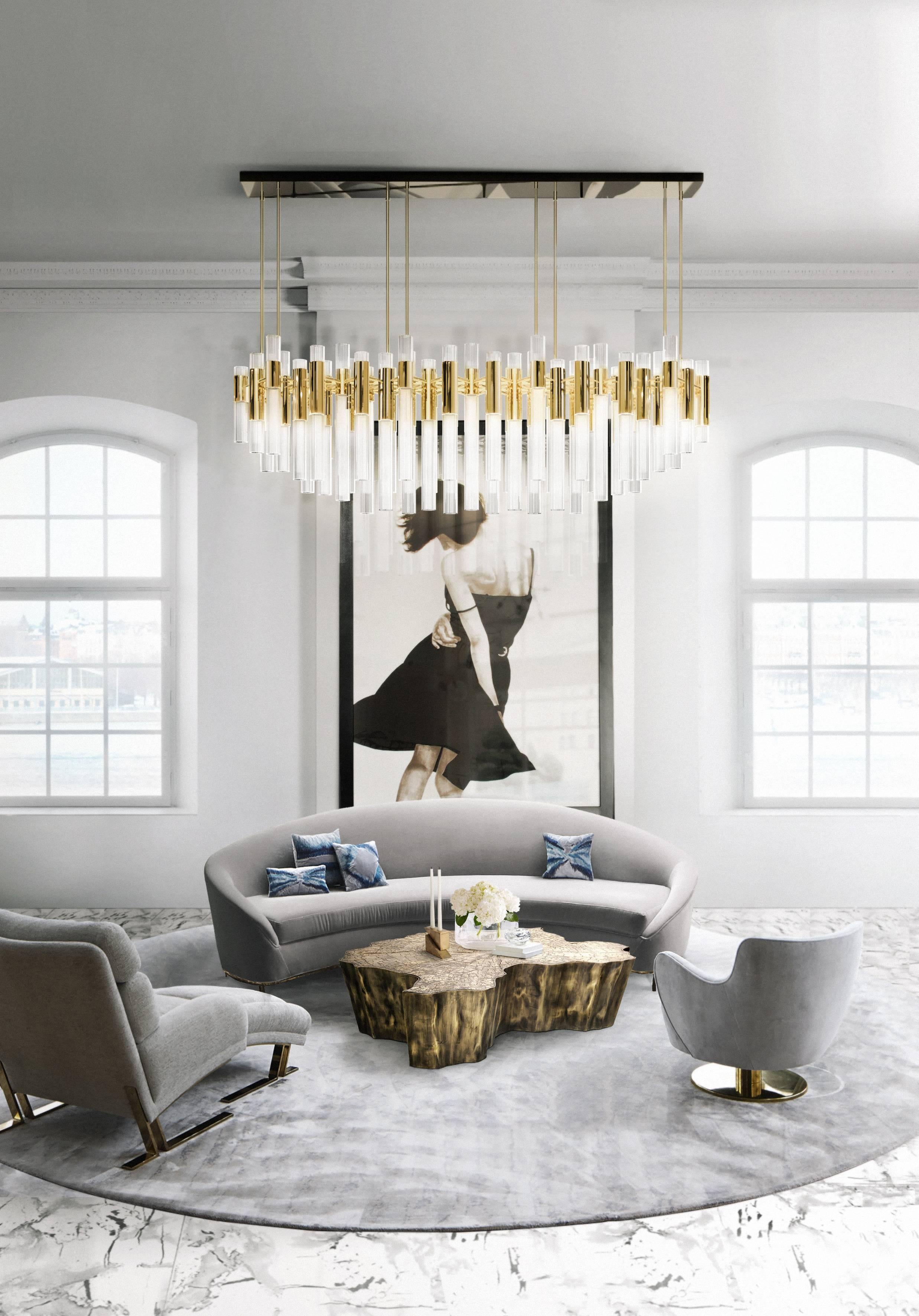 Everything sparkles under this elegant chandelier. This masterpiece made with gold plated brass combined with ribbed fine tubes of crystal glass brings a natural feeling of waterfalls to any space. The glamorous sensation of water in the tubes is