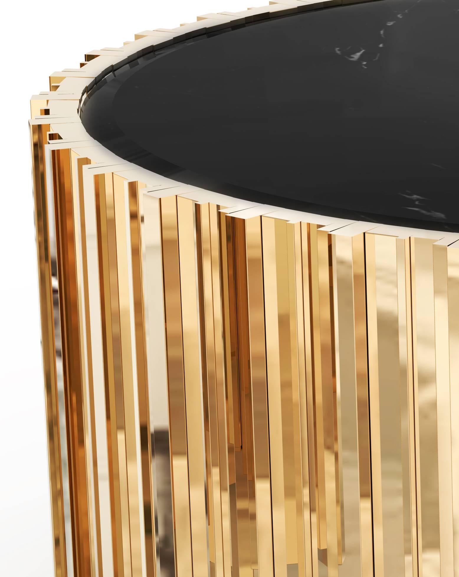 This center table has an extravagant shape of refinement and style. It is carefully made in brass and Nero marquina marble. This is a perfect combination between the classic and modern, design for every interior setting.

Materials:
Body: Brass