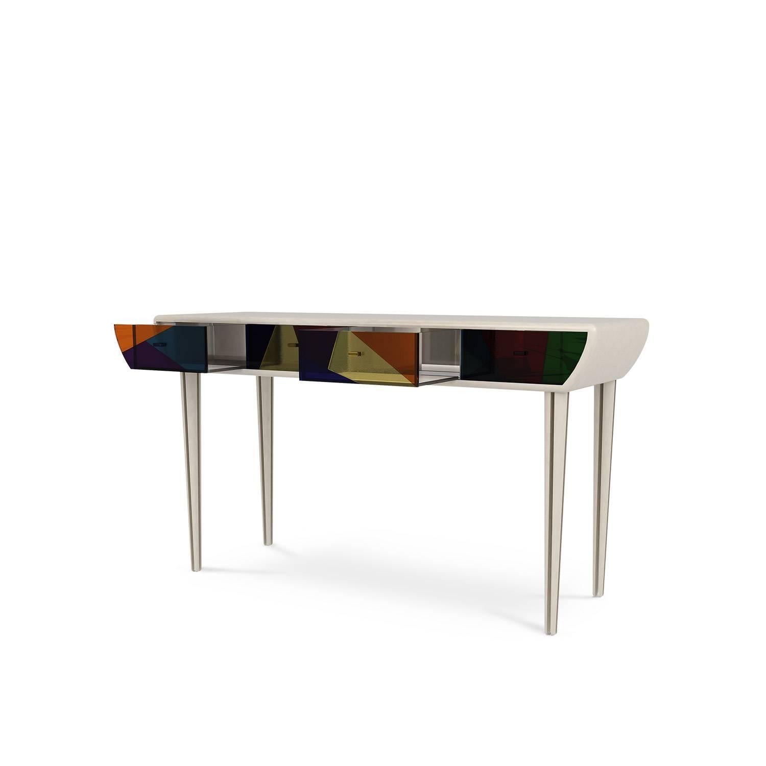 Vitral console is a tribute to the hand-painted glass tiles, keeping alive a traditional material, produced since ancient times. This contemporary console is an exclusive design piece that combines the dynamism of design with the power of narrative.