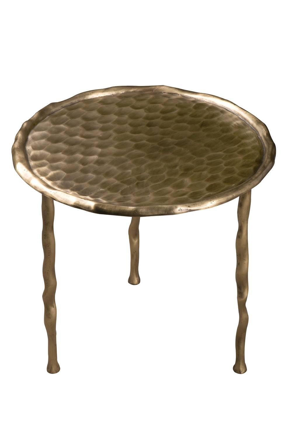 Matching set of two French artistic modern cast brass side tables.

Measures: Large: D 50 cm, H 47 cm. $1795.
Small: D 50 cm, H 42 cm. $1795.