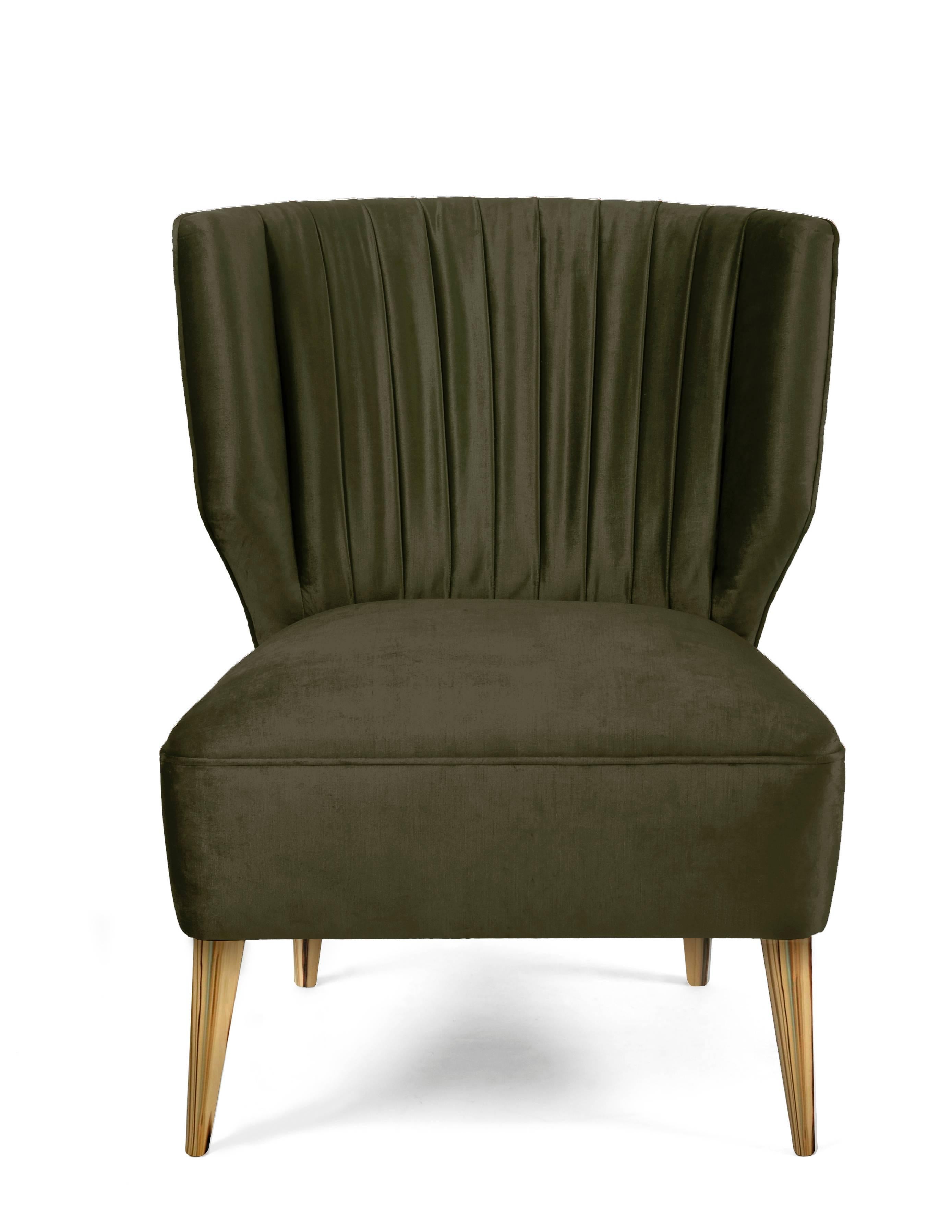 Olive green satin velvet upholstered armchair with golden polished nails and glossy varnished golden leaf legs. This armchair was inspired by the Bakairi tribe. The legend says that it was created by the twin gods Keri and Kame. Together they