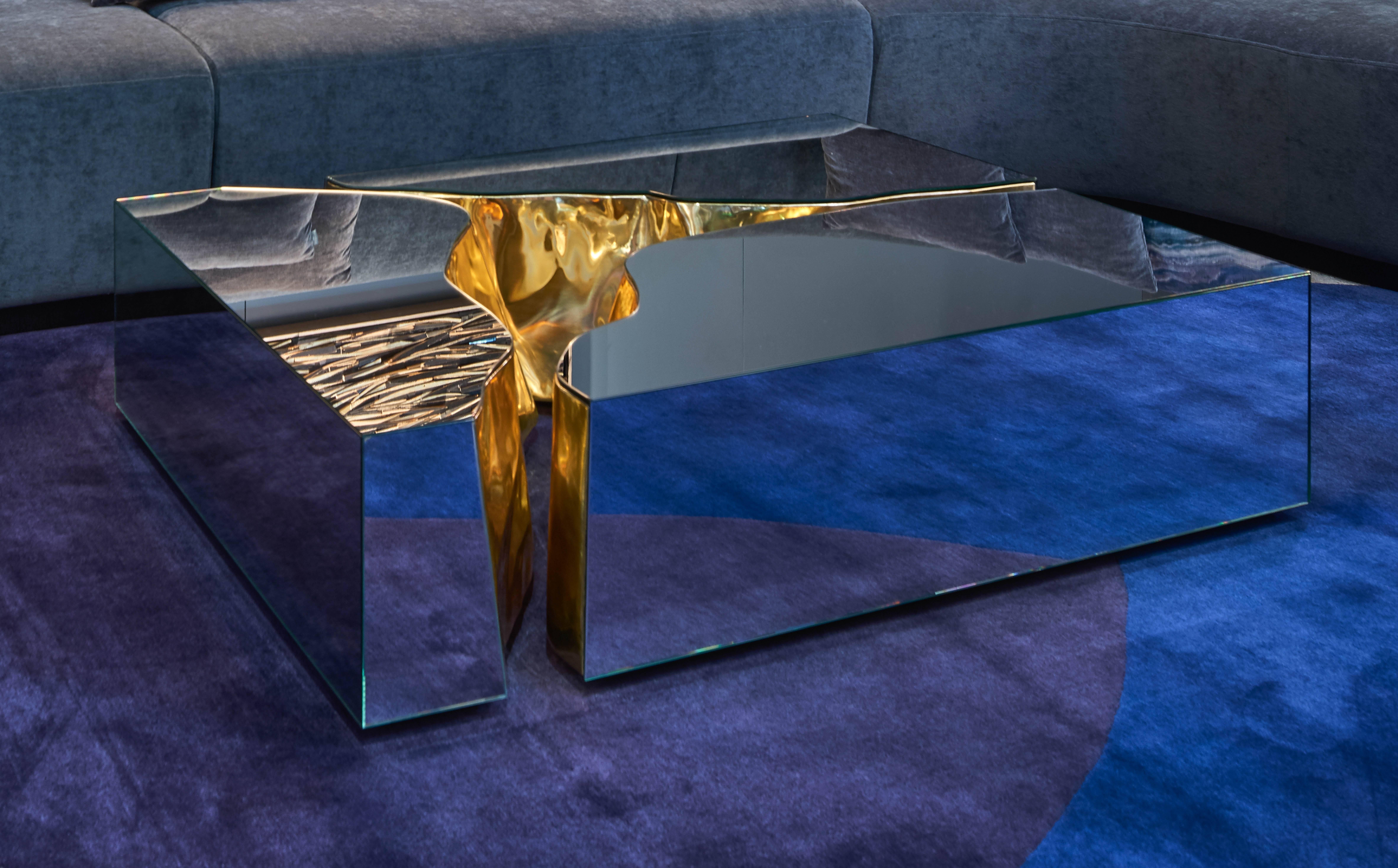 This mirrored coffee table is an incredibly luxurious sculptural centrepiece (picture 1-5). It was inspired by the typical karst Formations produced by surface dissolution of limestone or dolomite rocks. The stone freezes and cracks, to show a rich