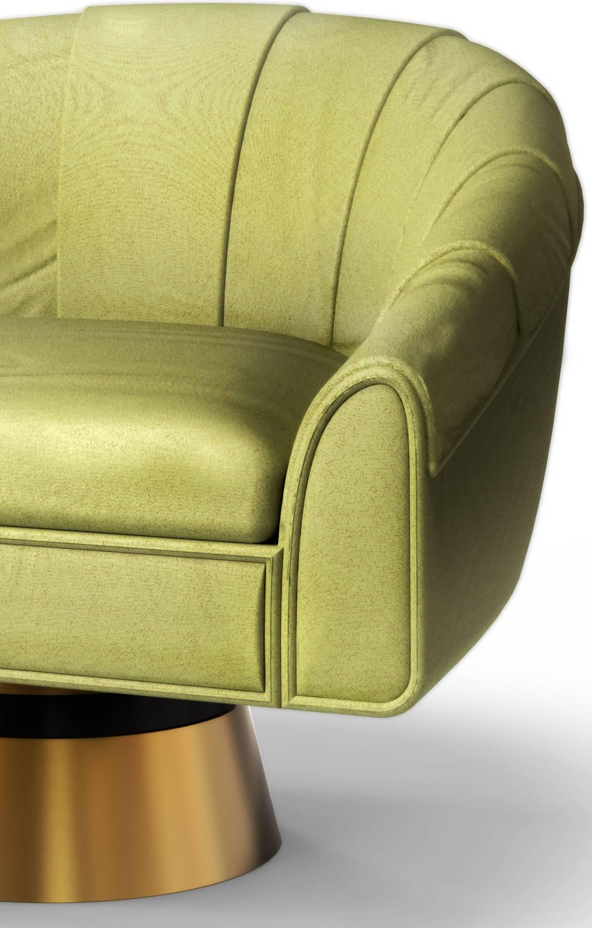 As you sit in this armchair, you are immediately taken to a more relaxed way of living. The soft neutral green color of the chair, very popular in the 1960s, gives it a modern and lighter touch. To contrast, the polished brass base of this chair