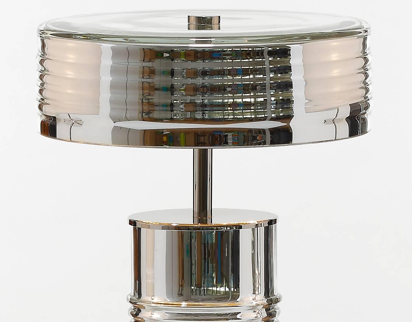 Elegant and refined lamp, designed and crafted by Portuguese artisans. A bold shape that embodies the Art-Deco era.

Measures (cm): 66 x 40
Lamps: Two lamp e14 max. 40w
Class: Class II
Material: Glass/brass
Finish: Nickel
Weight: 11