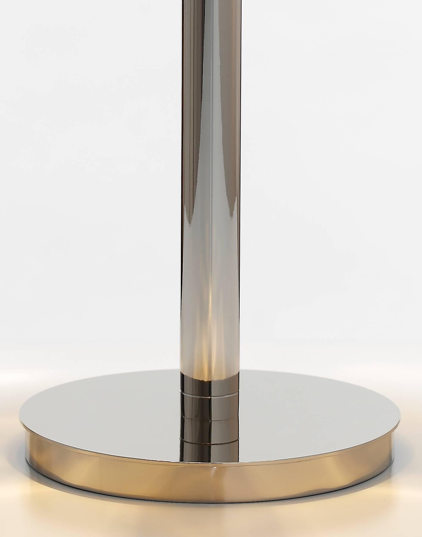 A simple but very stylish table lamp inspired by the Art Deco era, beautifully crafted by Portuguese artisans.

Measures (cm):55 x 32
Lamps: Two lamp e14 max. 40w
Class: Class II
Material: Glass/brass
Finish: Nickel
Weight: 6 kg
Packaging