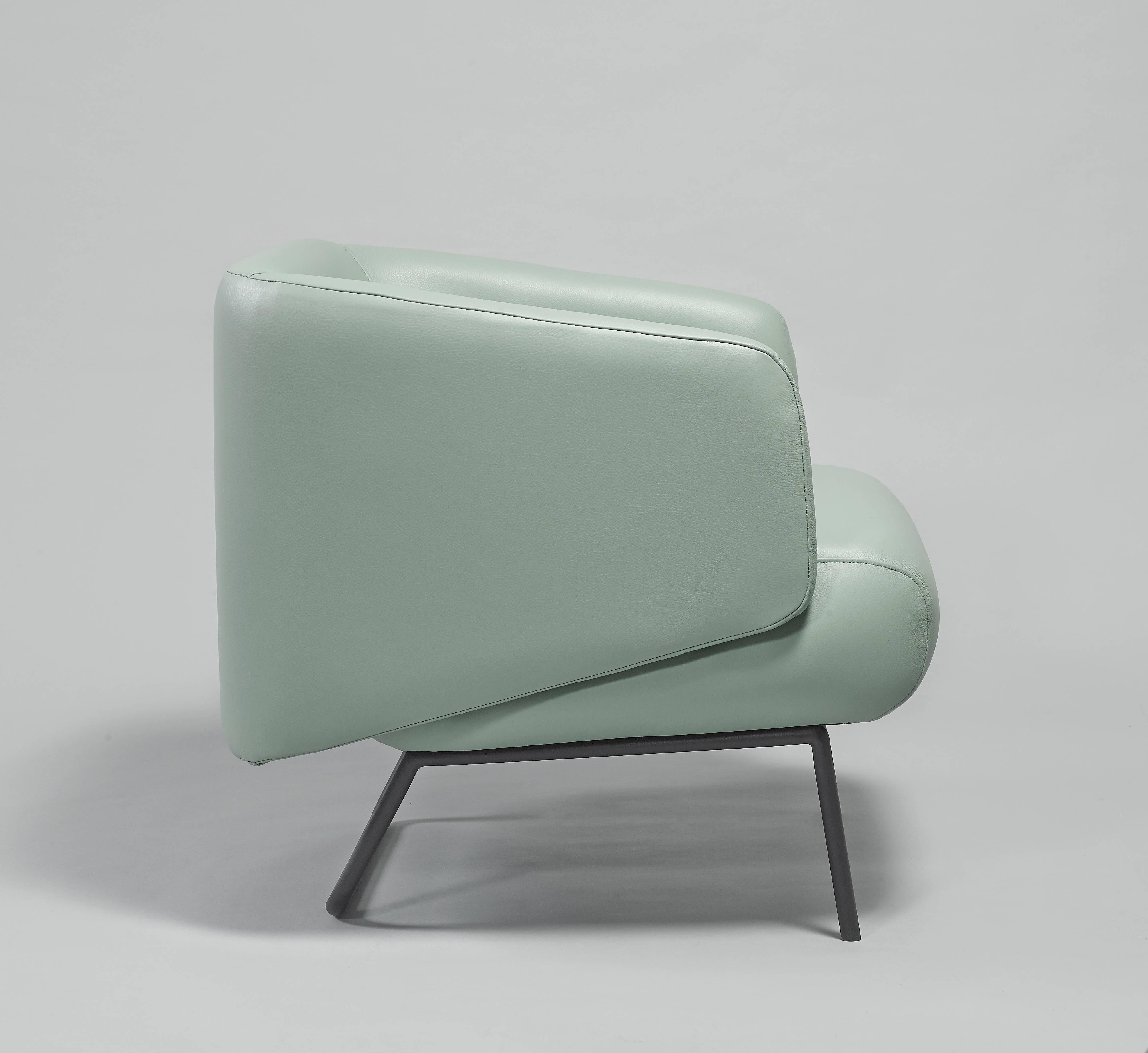 Modern European modern pale teal green leather and black epoxy armchairs For Sale