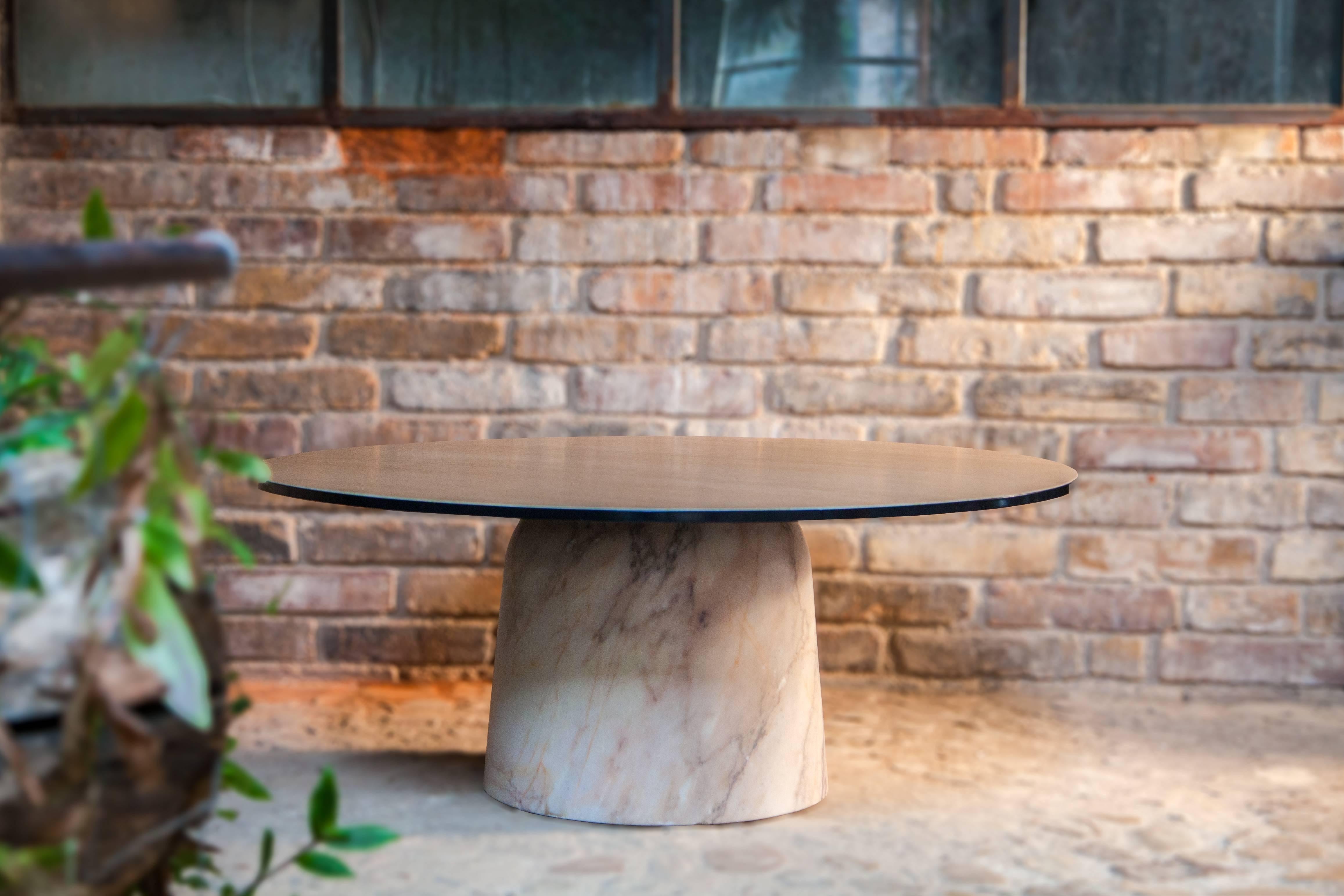 Simple elegant modern design with a sturdy unique marble leg which allows the tabletop to be disconnected from the floor to create the feeling of floating. The marble leg and the oak tabletop are both sculpted by a turner. Their invisible assembly