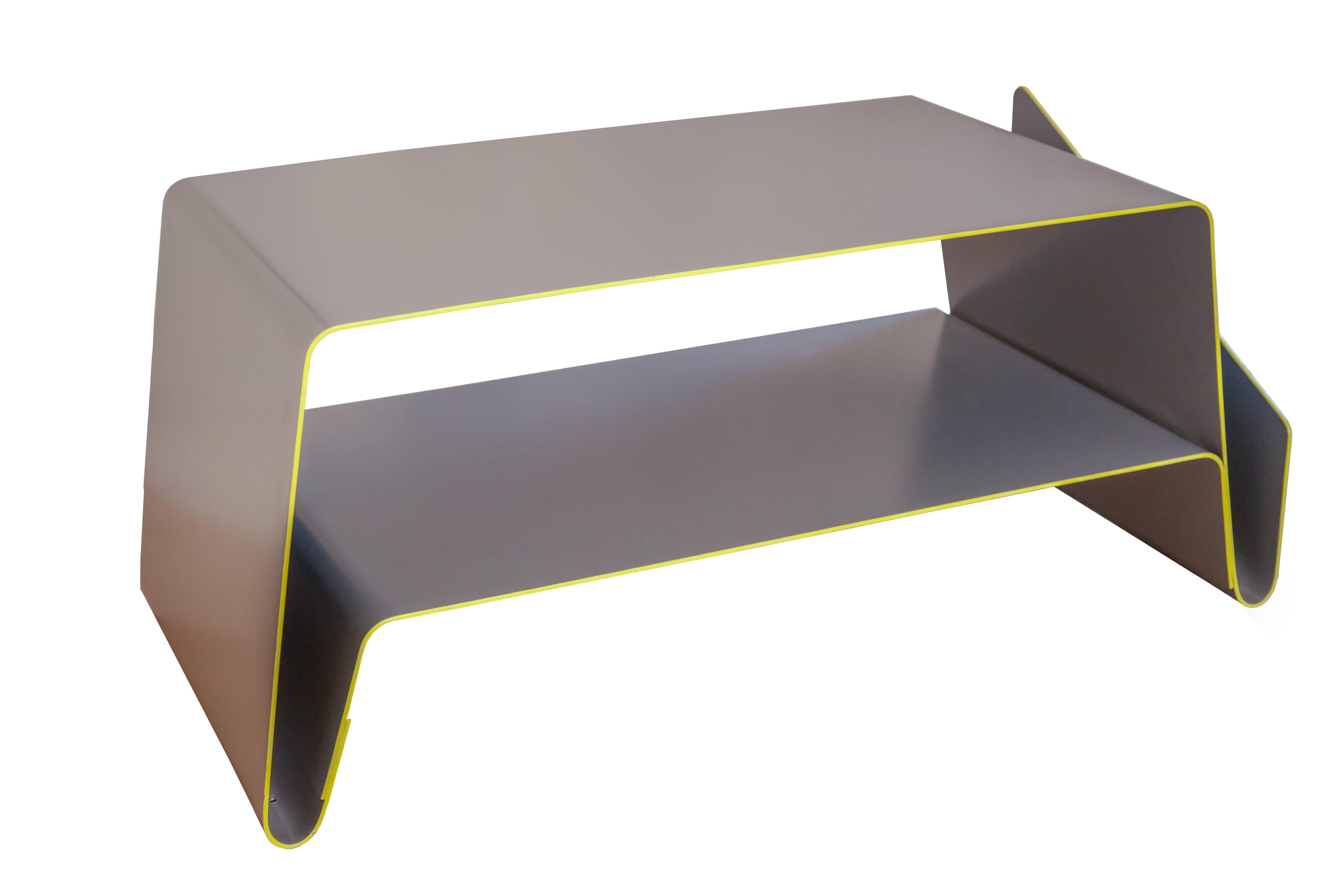 A stylish and practical modern table which uses colour to highlight the softness of its lines and curves. The structure is made of aluminium to create that smooth Minimalist surface. Every corner is smooth and rounded, creating a flowing unique