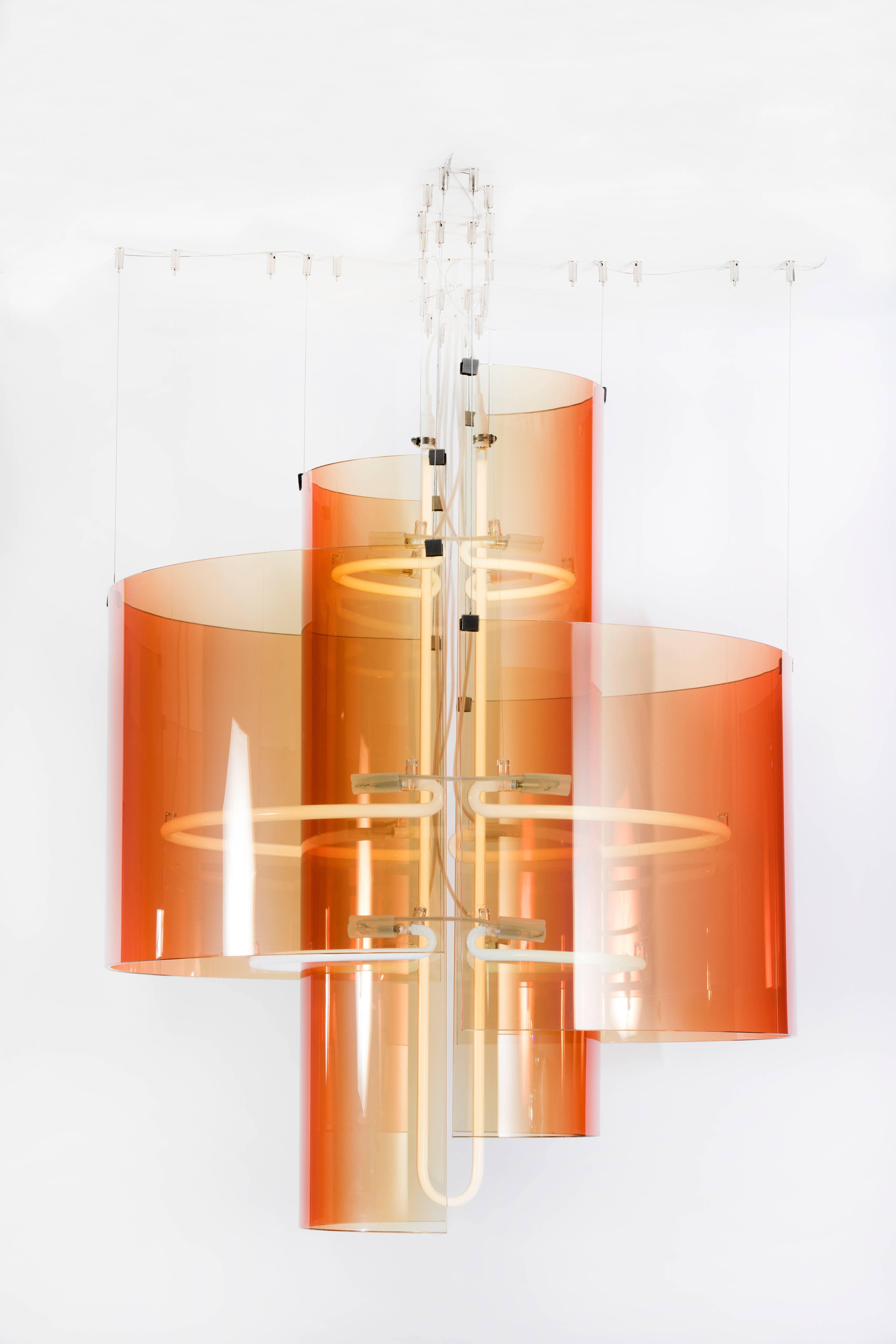 Commissioned by Etage Projects for Salon Art + Design 2017, the Chandelier by Sabine Marcelis features shells of deep amber glass circling neon rings in this airy design.