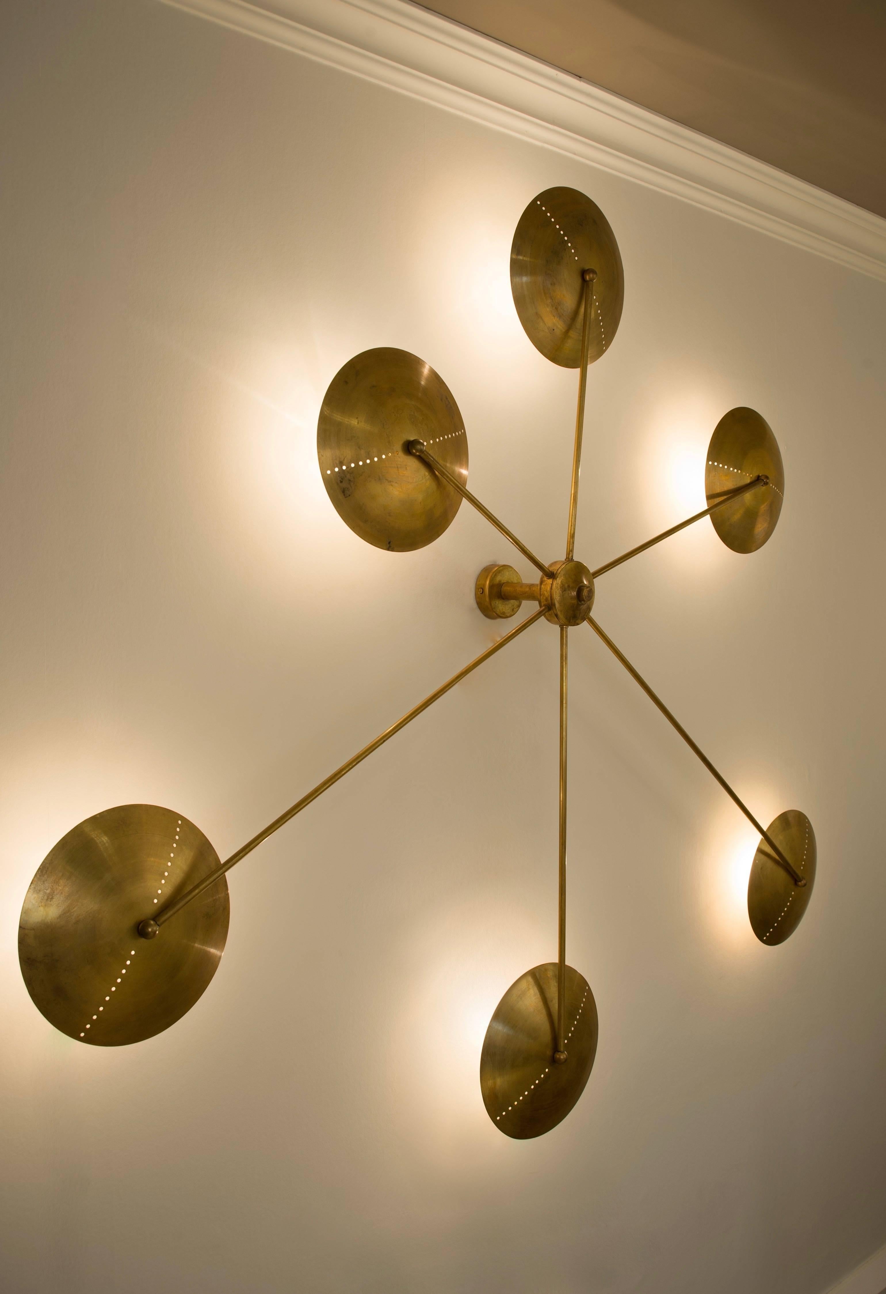 Made from brass this wall sconce can be assembled in various configurations to suit each interior. Dimensions are per assembly shown.

Can also be ceiling mounted.