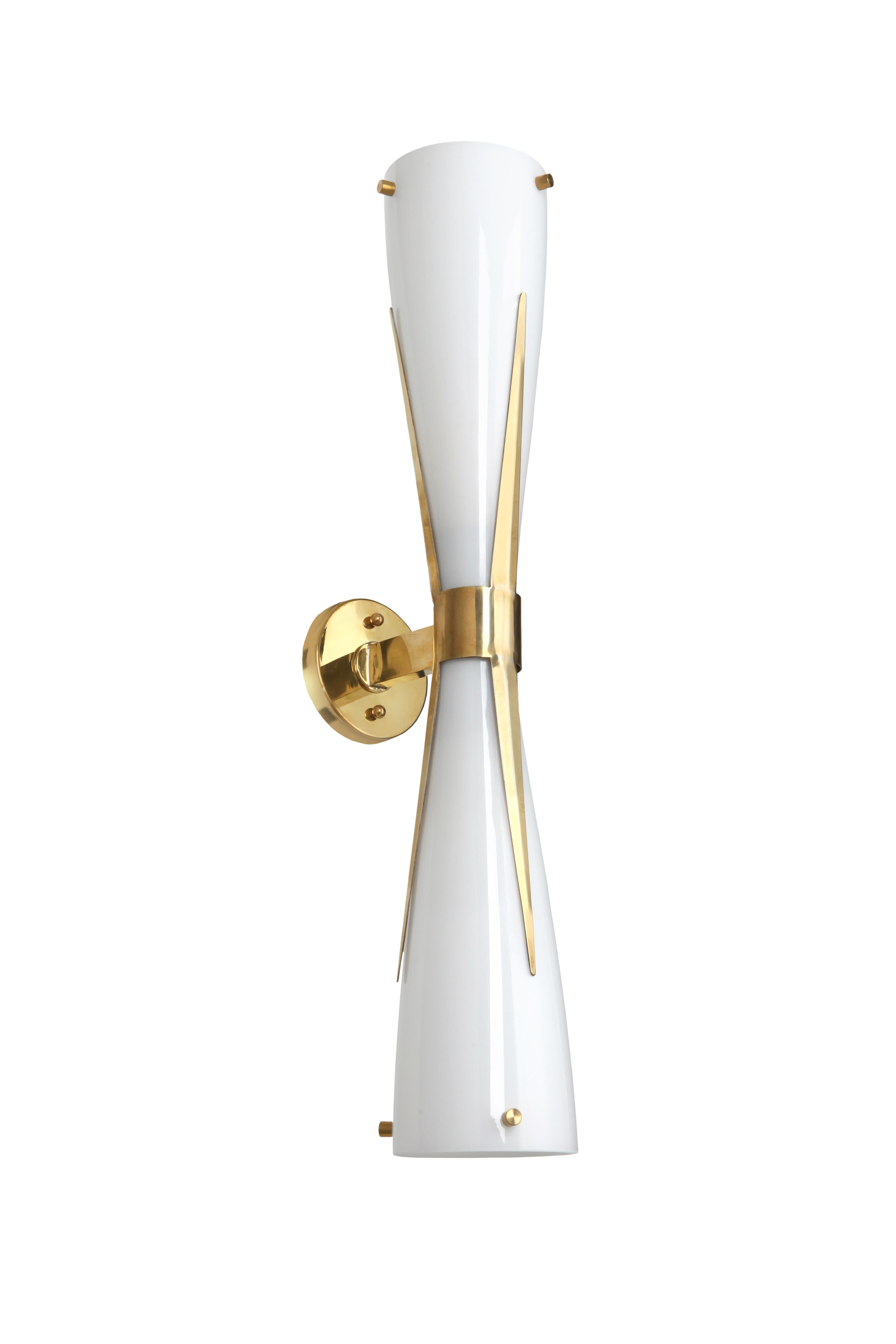 An Italian hour-glass shaped Murano glass light with brass cuff and shard detailing.

Taking inspiration from midcentury Italian design, the deceptively vintage appearance comes from the natural brass, worked in the traditional way which has