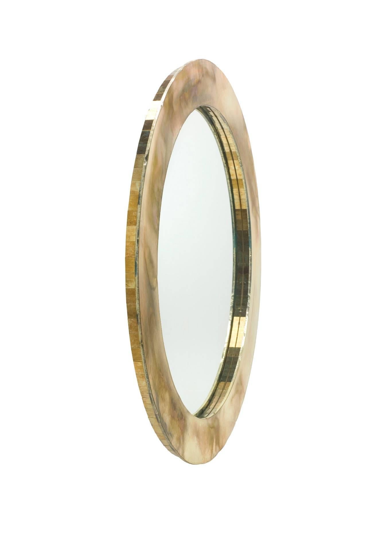 Life mirror by Sabrina Landini. Hand-silvered glass using precious metals. Small cut pieces of glass are inlayed into the inner rim and on the outside of the piece which gives a unique reflective and refractive effect.

Manufactured in Tuscany,