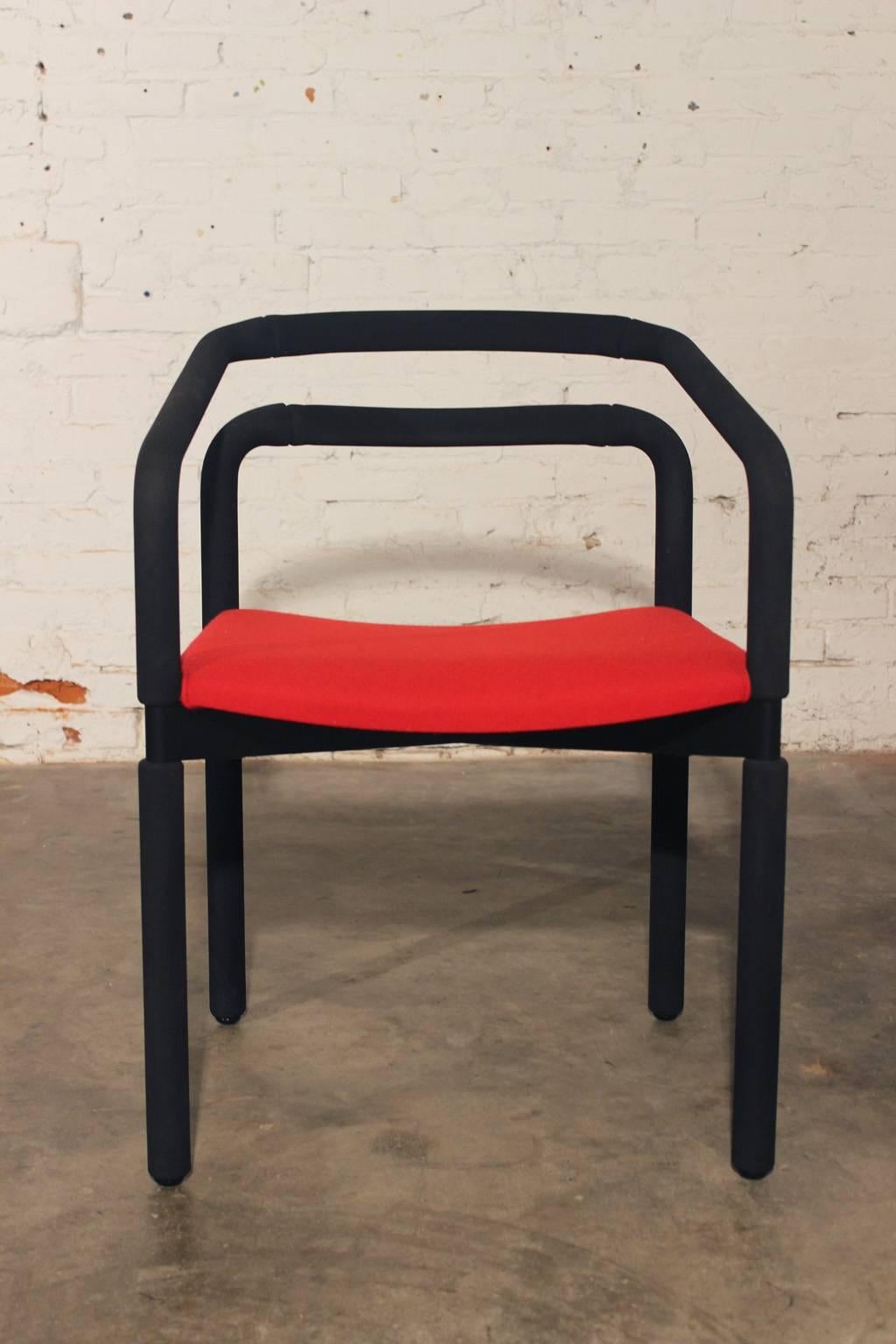 Fabulous set of six bold black and red rubber armchairs by Metro for Steelcase designed by Brian Kane. In wonderful ready to use vintage 1992 condition.

Bold and sleek is how I would describe these fabulous vintage rubber armchairs designed by