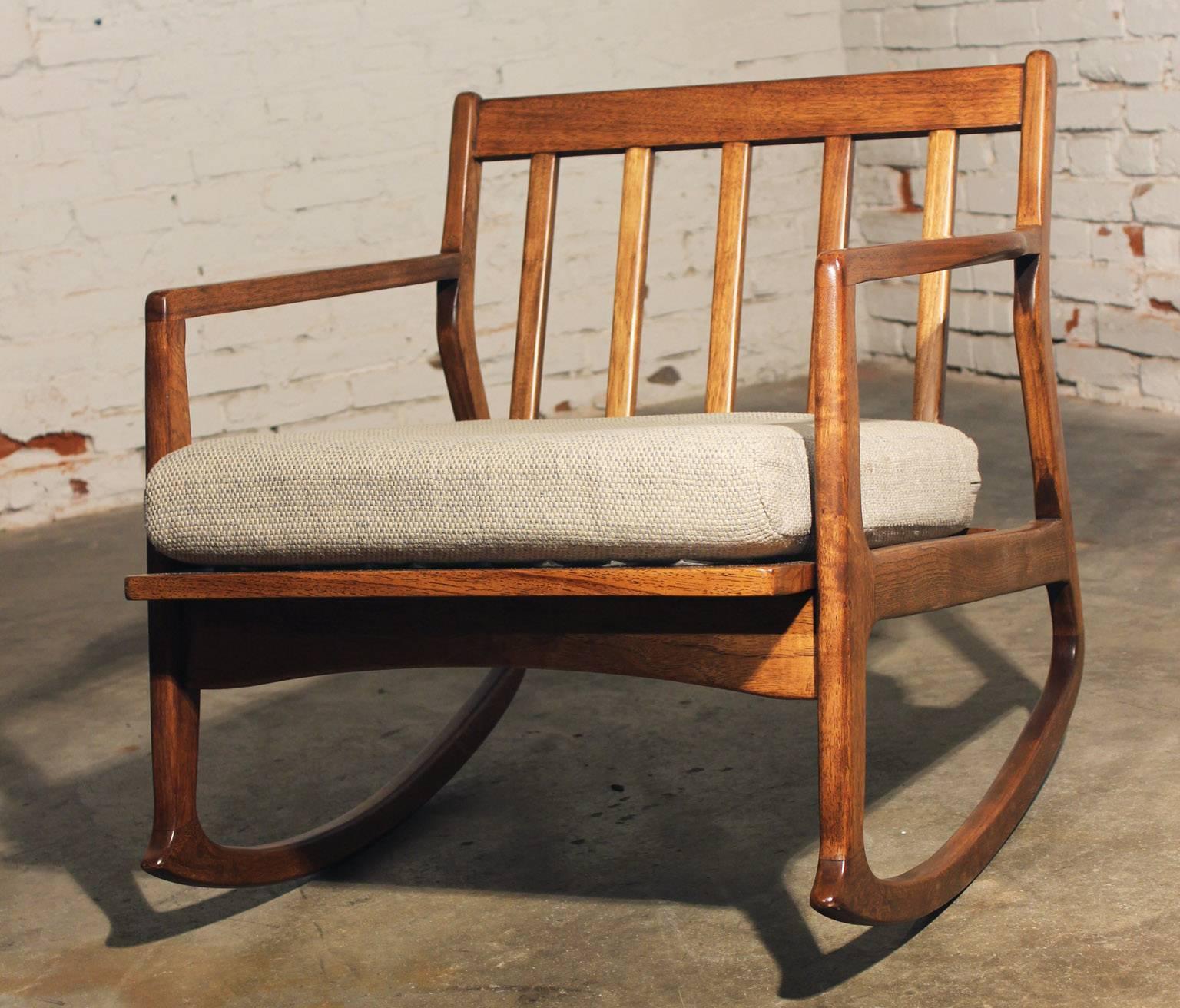 Wonderful Mid-Century Danish Modern rocker in great vintage age appropriate condition.

Here, in my opinion, is one of the hardest pieces of mid-Century Furniture to find a rocking chair! And this one is a wonderful example. The wood on this
