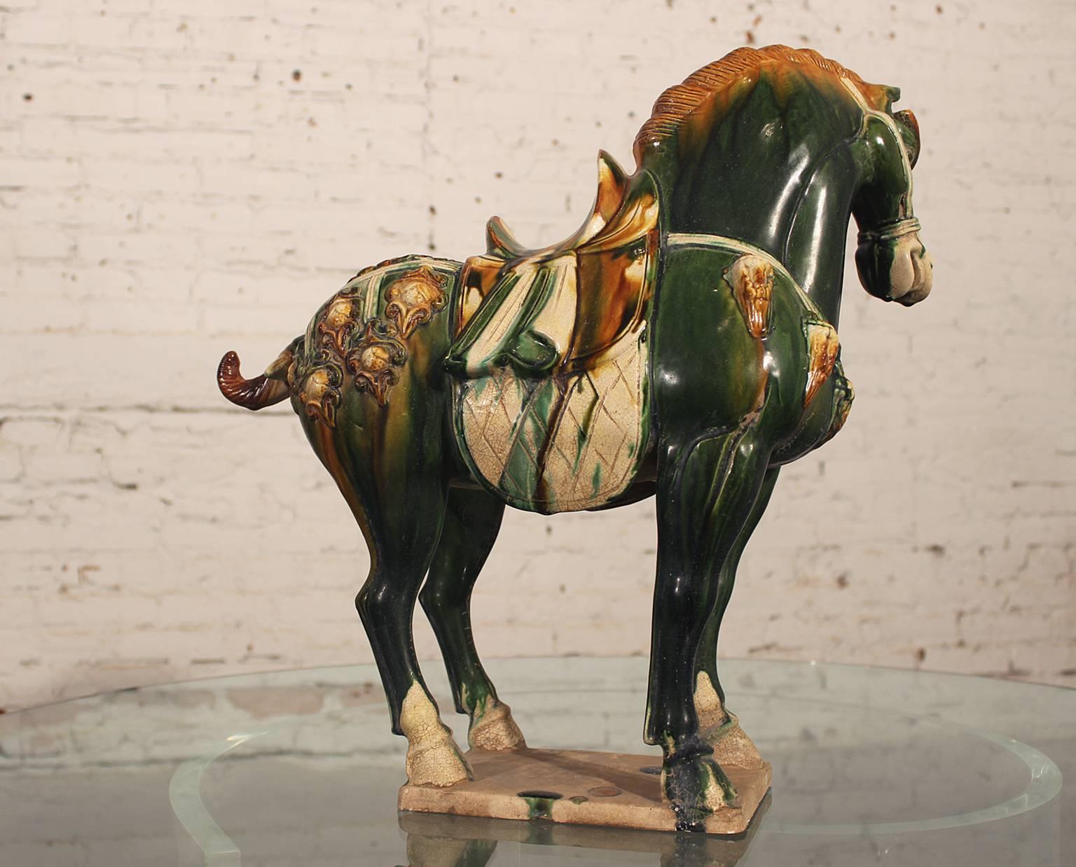 Well-crafted early 20th century Tang style horse in the gorgeous tri-color glaze. This horse is in wonderful condition.

This is an early 20th century example of the Tang horse and although not of the Tang period, he is very well-crafted and took