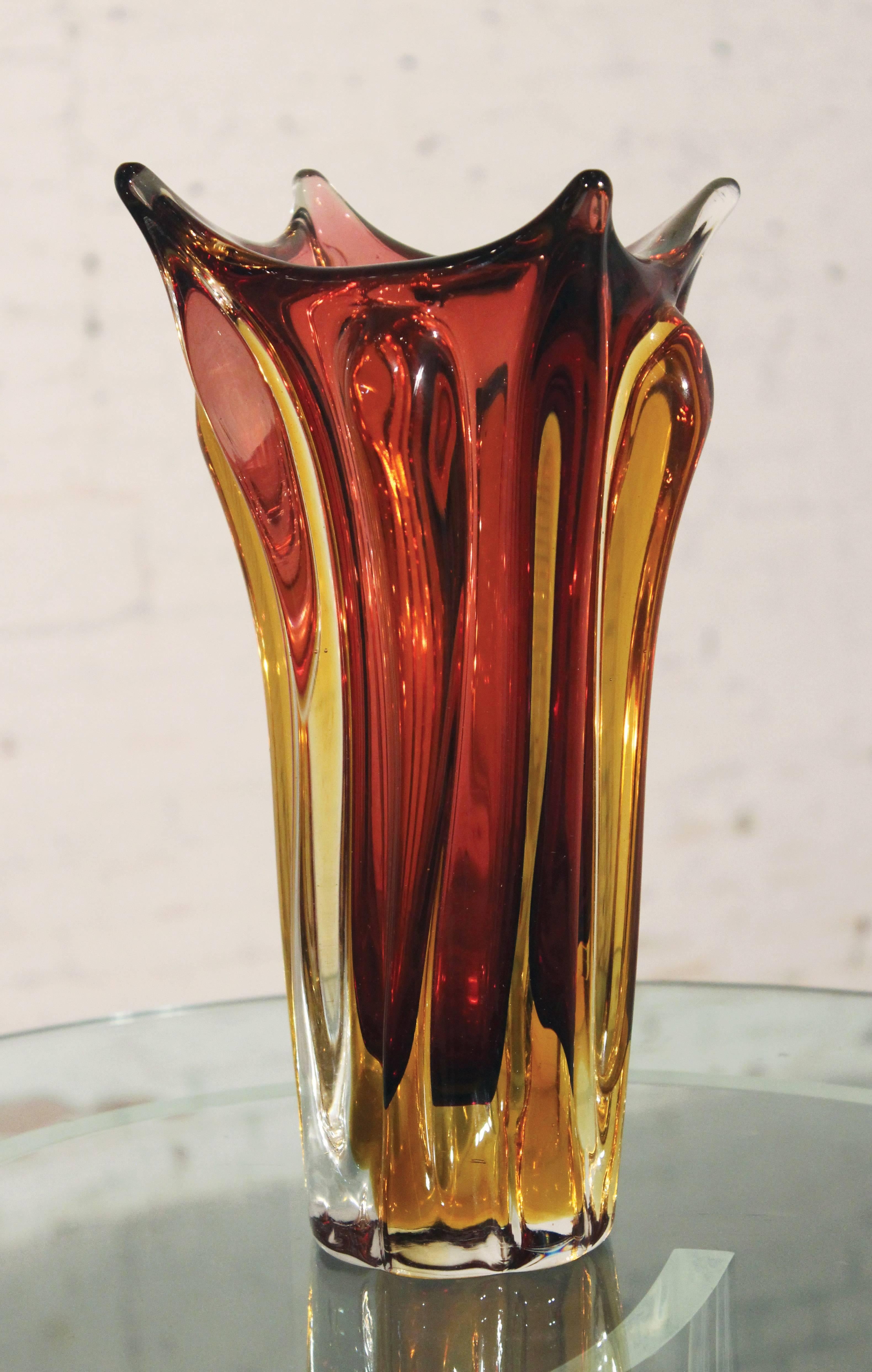 Beautiful red and amber Sommerso Murano glass vase in very good condition.

Just gorgeous! Very large and very heavy 20th mid-century Italian Murano Glass Sommerso vase in red and amber. It's four pulled points make it look like a beautiful