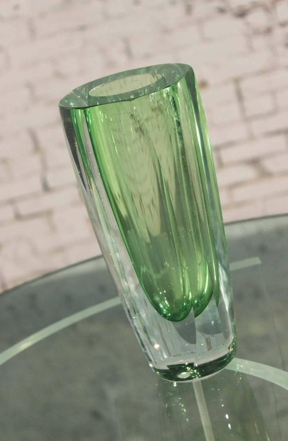 Gorgeous green and very thick and heavy sommerso and faceted vintage MCM Murano glass vase, circa 1960 and attributed to Flavio Poli for Seguso. Condition is good vintage with one small chip to inner rim that can easily be polished out.

Just