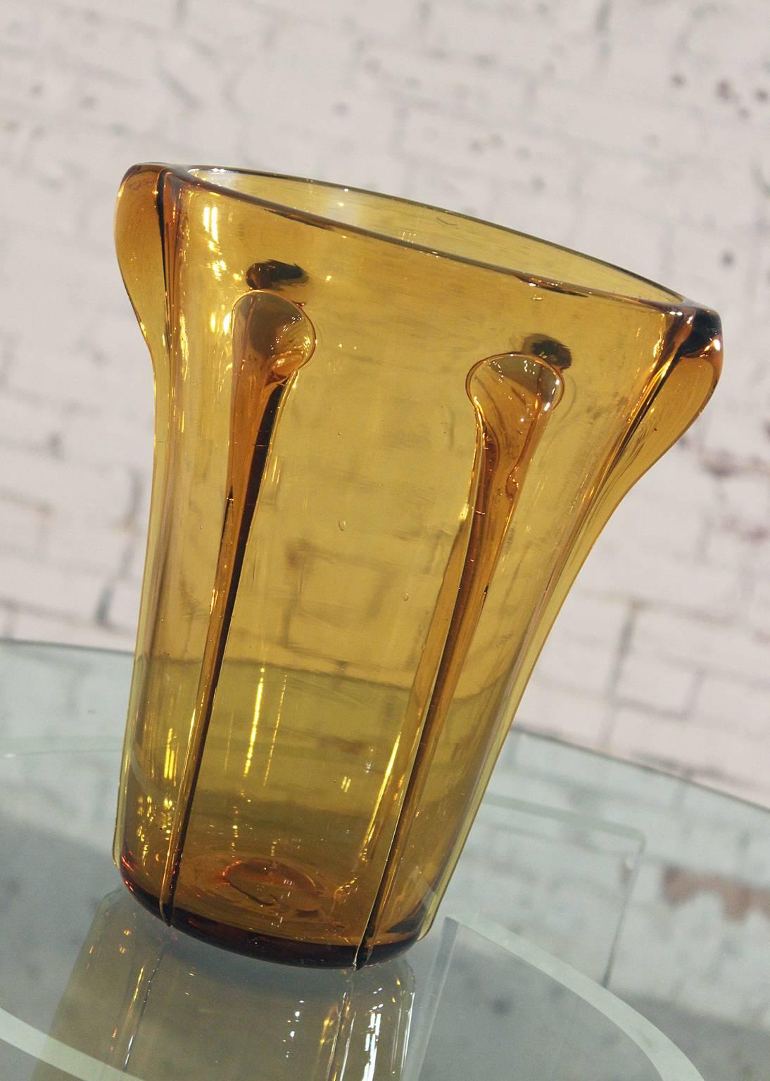 Gorgeous vintage mid-century amber blown glass Empoli vase from the Empoli region of Italy. It is in great vintage condition without chips, cracks or chiggers.

This vintage mid-century vase is so incredible!!!  Very large, 11 inches tall and 9