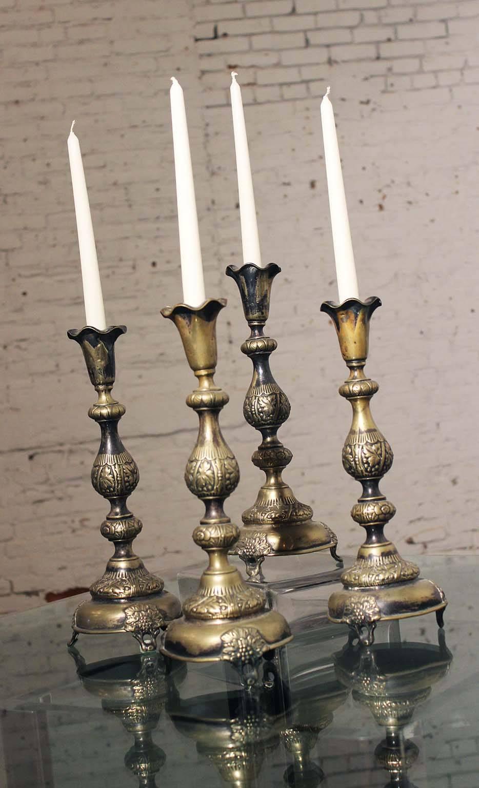 Set of four Sabbath candlesticks with gorgeous age patina. Very aged and beautiful.

Incredible set of four circa 19th century Sabbath Russo-Polish candlesticks. They are each marked with the inscription Fraget N Plaque (translated means: Fraget