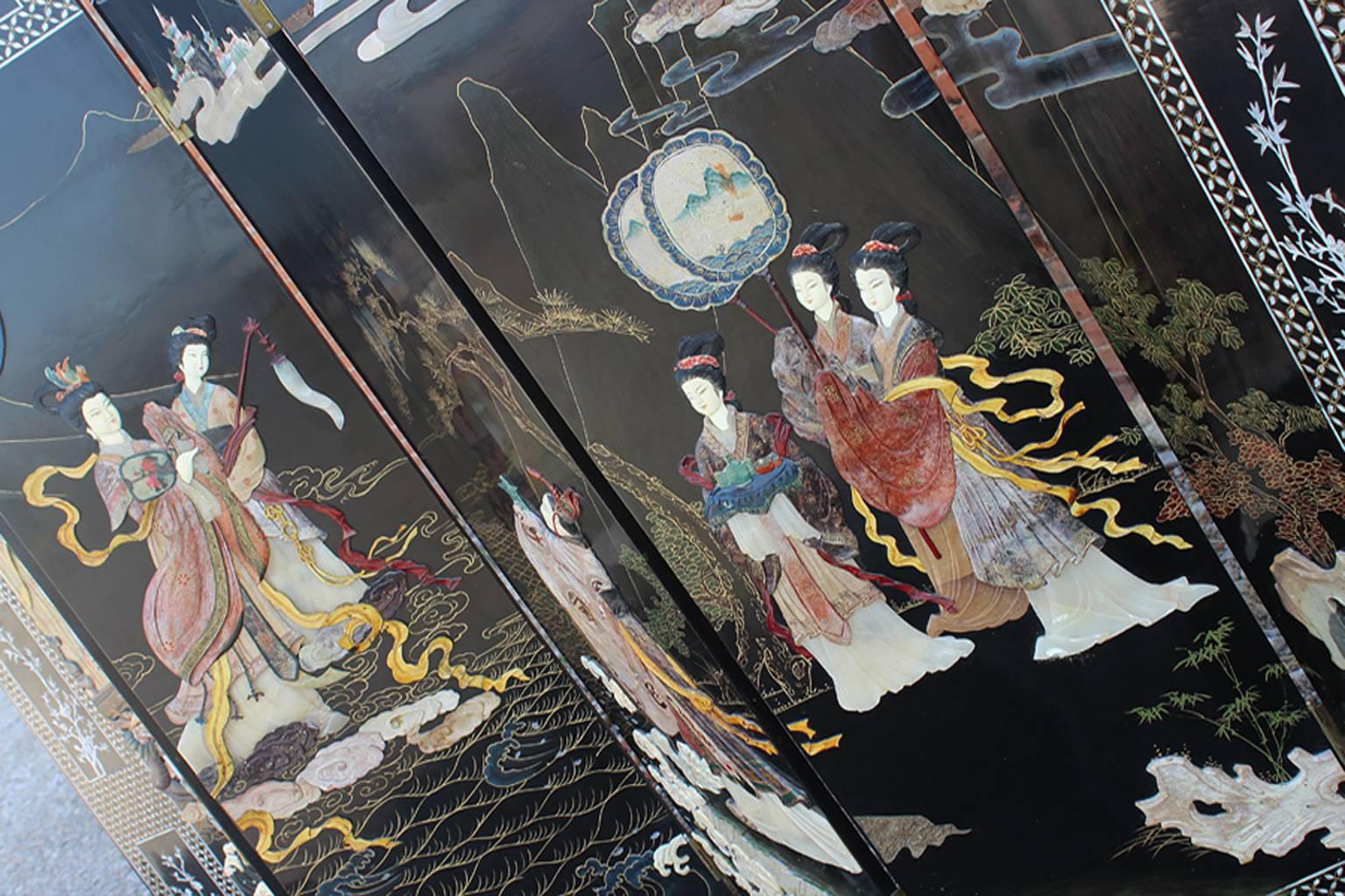 Gorgeous six-panel Asian black lacquered or ebonized folding screen with hardstone and jade carvings. In wonderful vintage age appropriate condition. We did find a few chips to the lacquer – see photos.

You must have this magnificent vintage