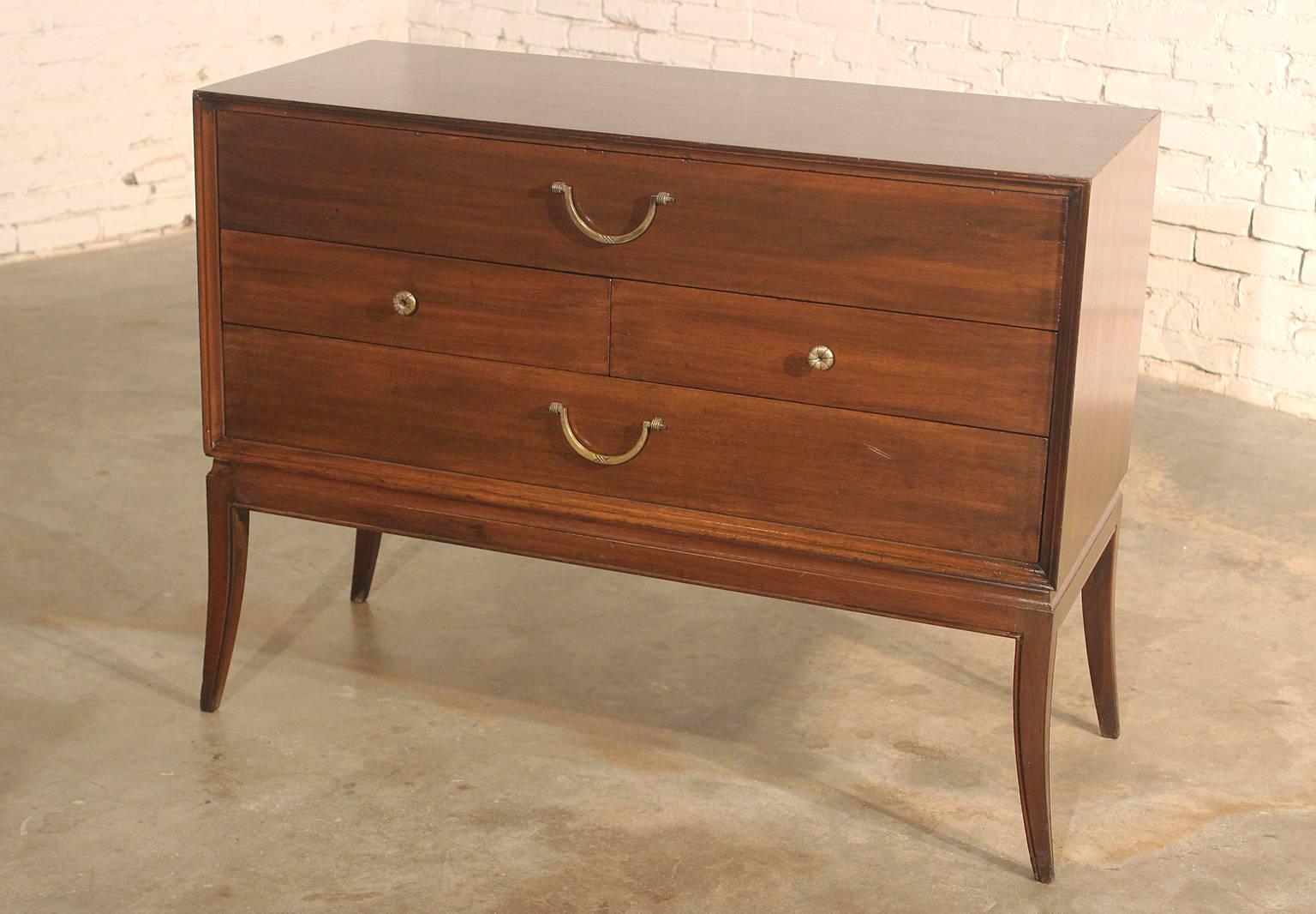 This awesome three-drawer mid-century modern cabinet in mahogany by Tommi Parzinger for Charak Modern is in good original vintage condition.

Gorgeous three-drawer mahogany cabinet designed by Tommi Parzinger for Charak Modern. This cabinet exudes