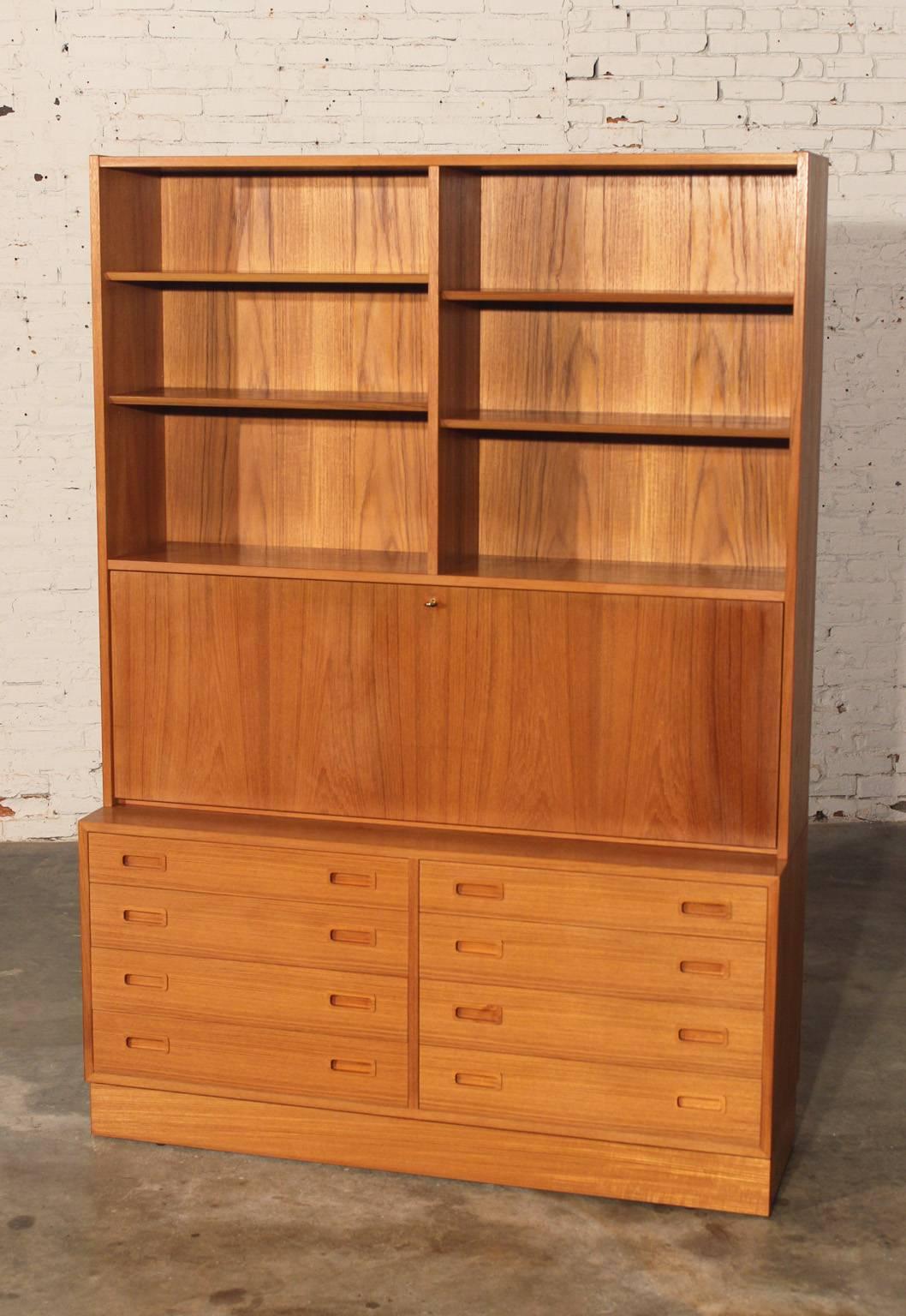 Wonderful Poul Hundevad secretary bookcase desk. This one is all teak and in wonderful vintage condition.

This gorgeous secretary was designed by one of the premier Danish Mid-Century designers, Poul Hundevad. As many of the mid-century designers