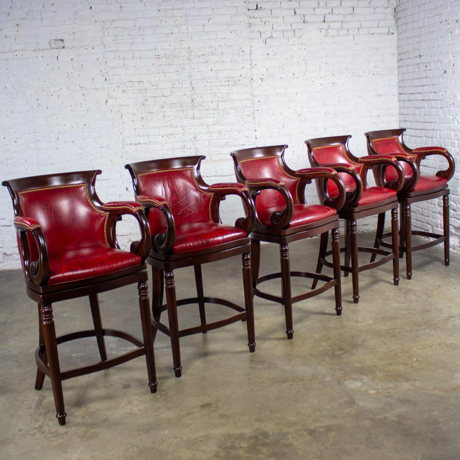 Marvelous vintage Traditional Neoclassic style barstools by Hancock & Moore composed of hardwood frames & red leather seats, backs, & armrests with antiqued brass nail head detail, set of 5. Beautiful condition, keeping in mind that these are
